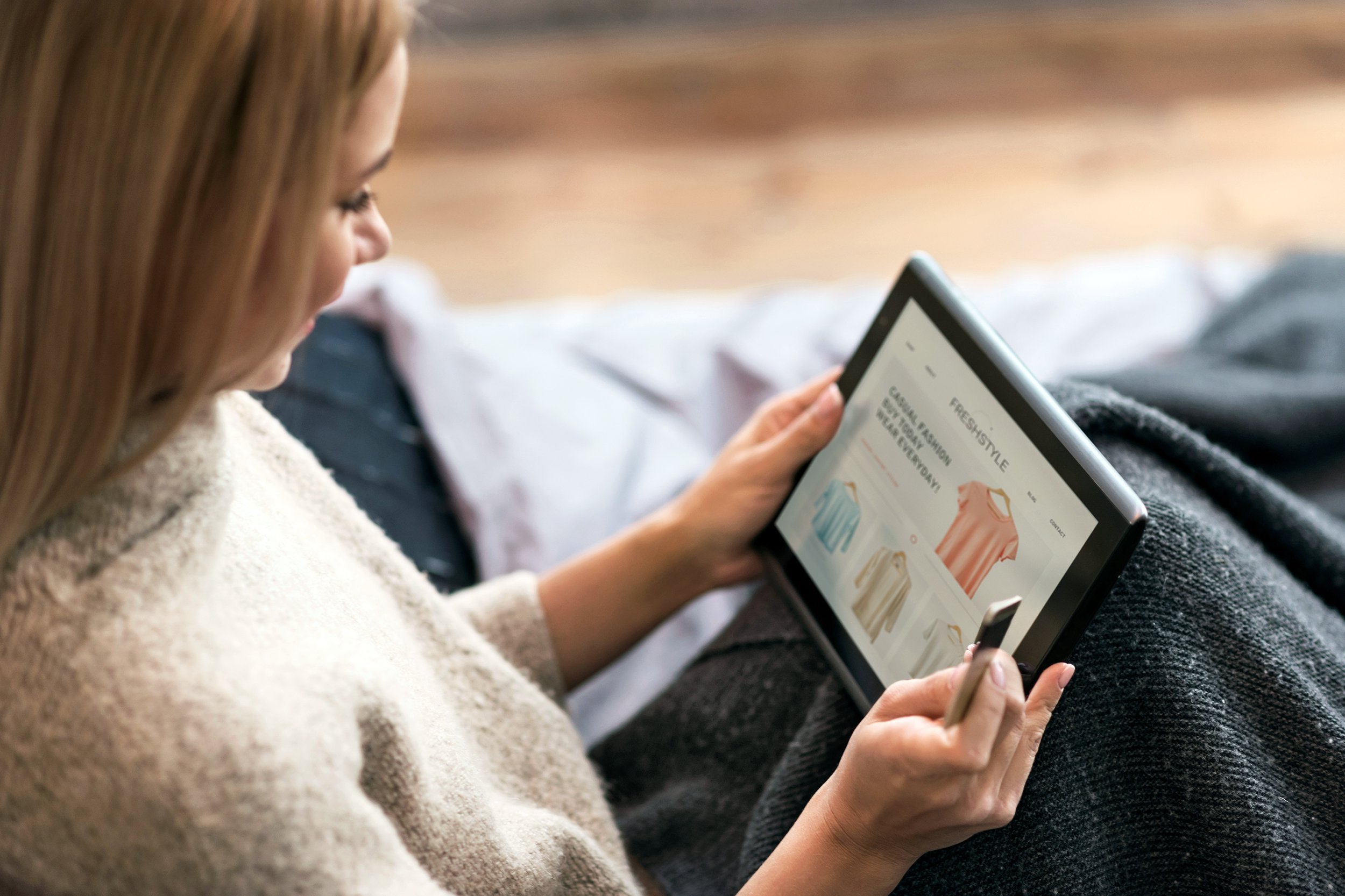 Woman shopping on her tablet