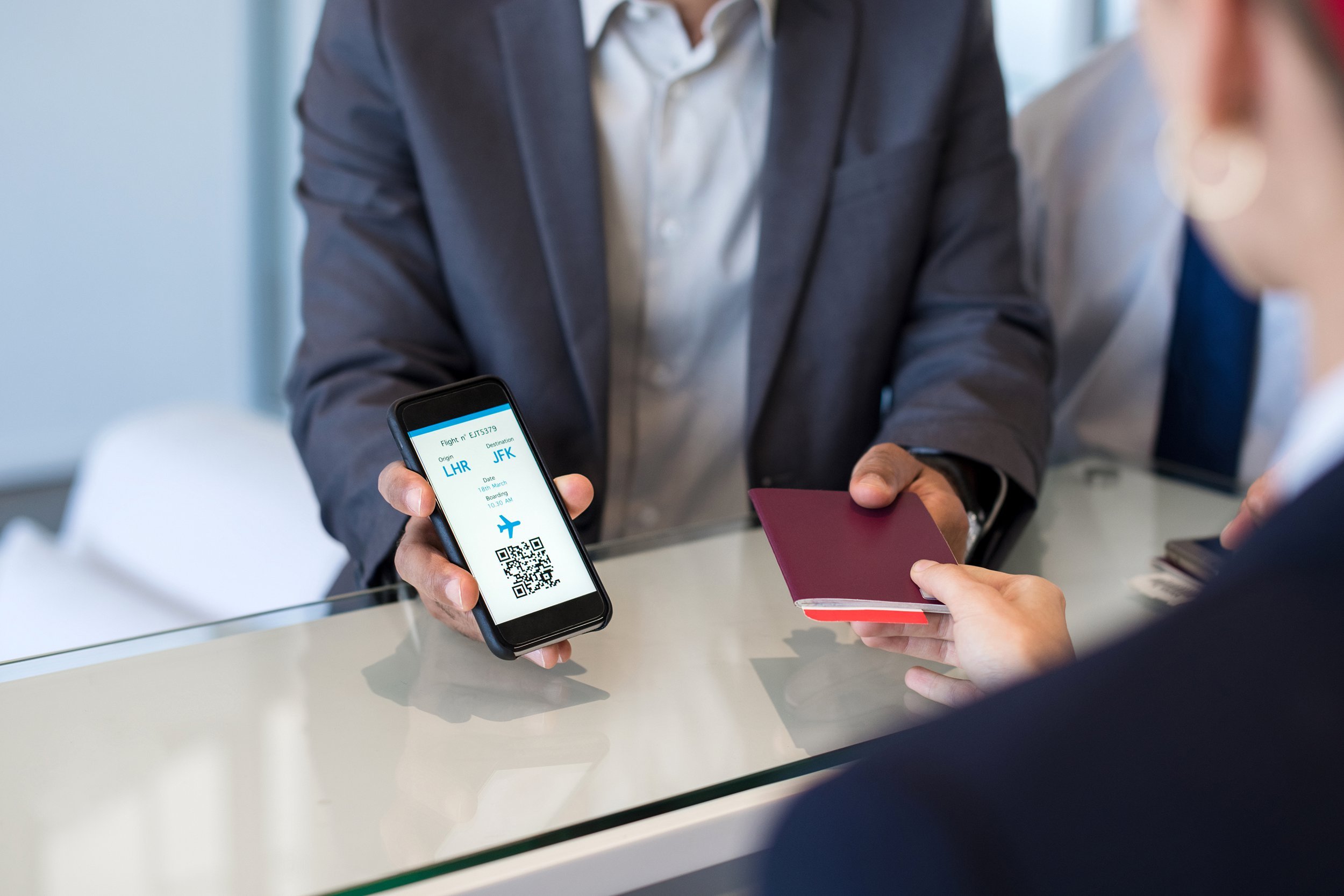 Man showing his ticket and passport at the airport