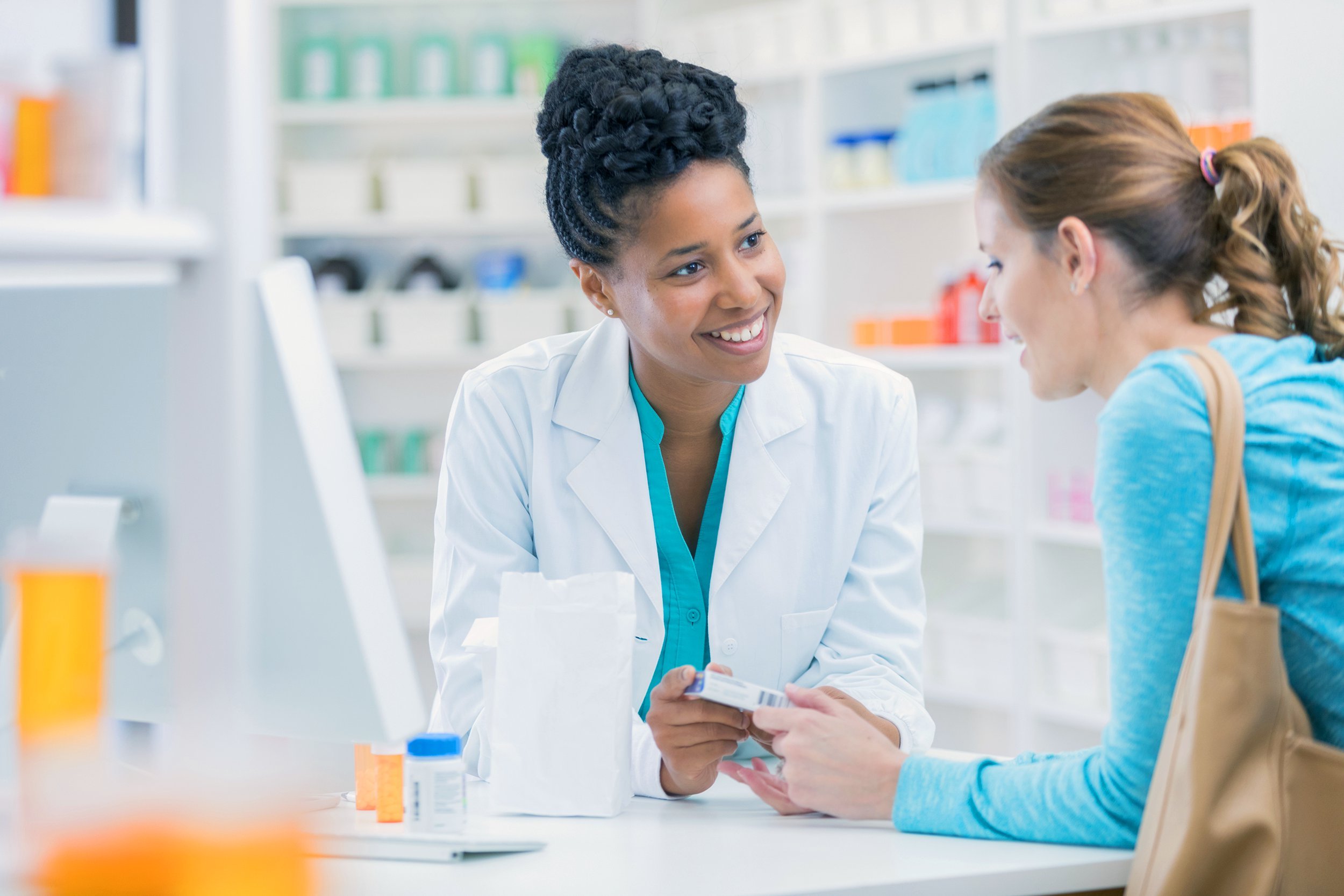 Customer speaking with a pharmacist