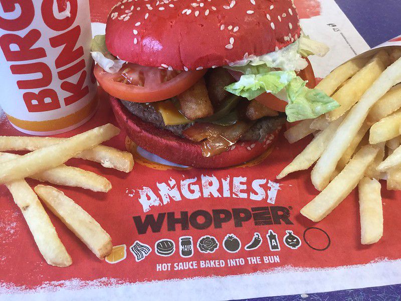 An image of a red-colored whopper from Burger King.