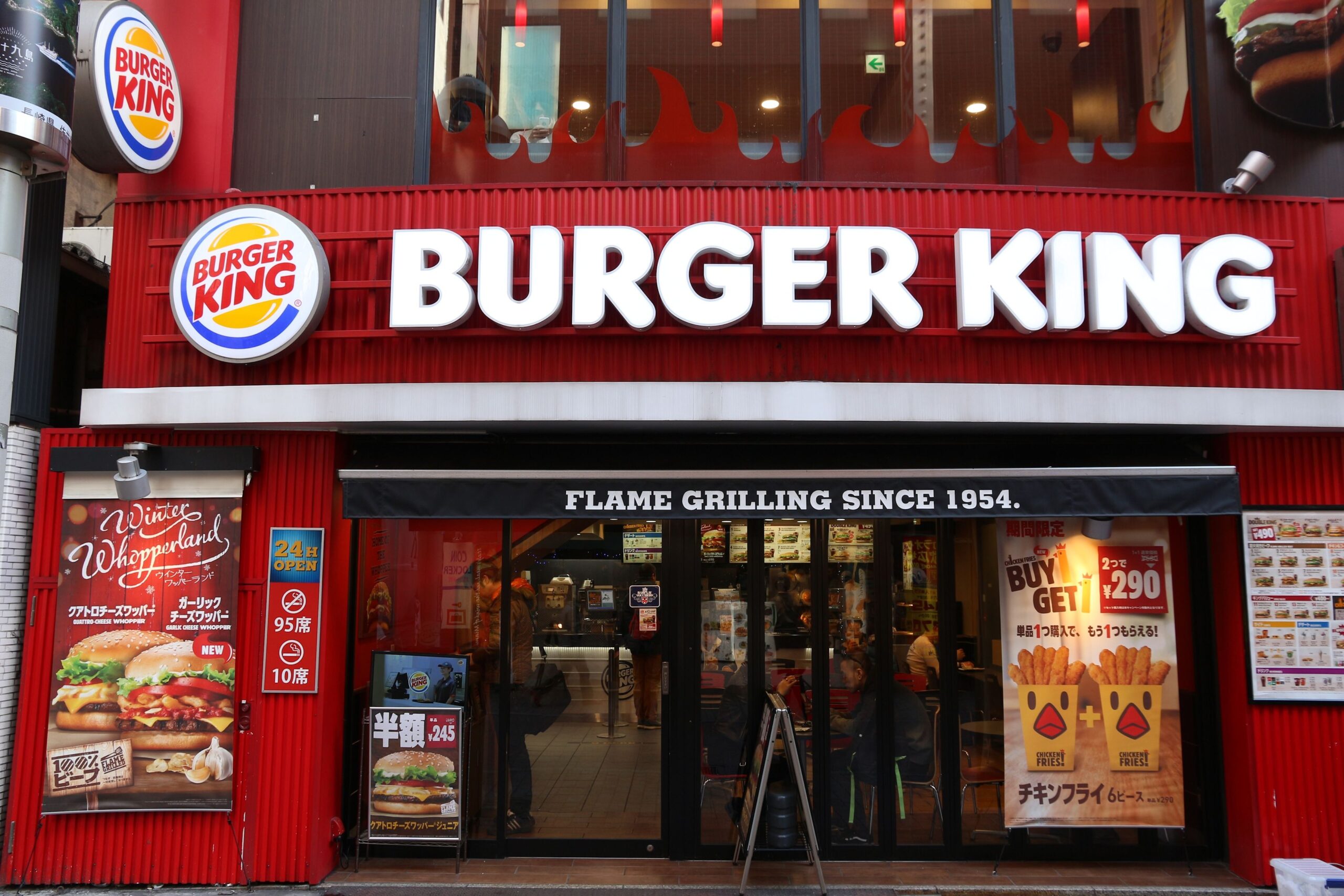 Tokyo, Japan - December 3, 2016: People visit Burger King fast food restaurant in Shibuya, Tokyo. Burger King has more than 15,000 restaurants worldwide.