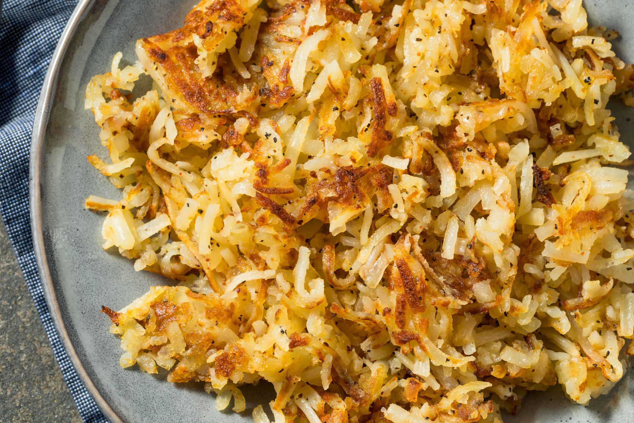 Homemade Fried Shredded Hashbrowns and Eggs for Breakfast