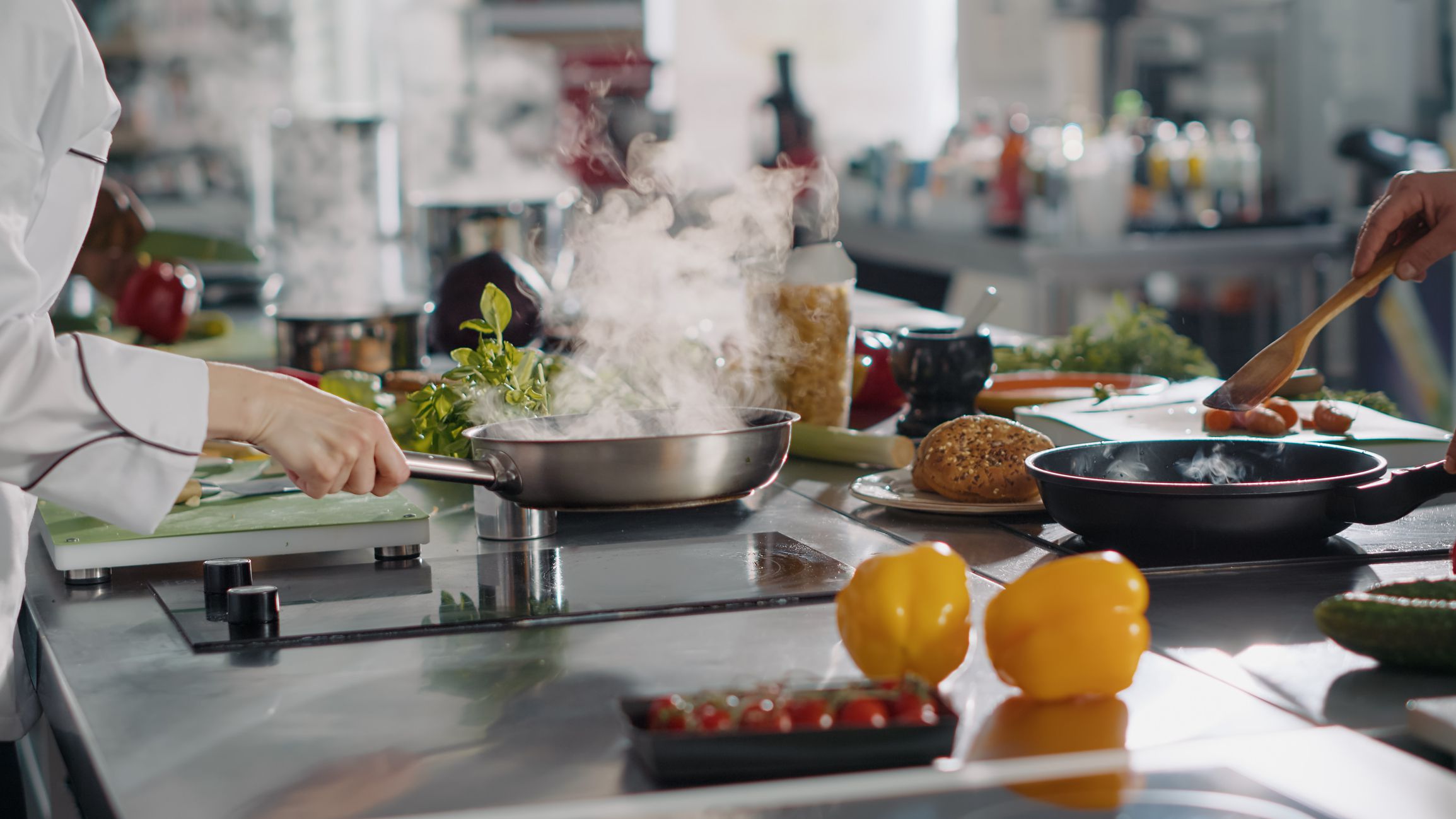 Professional cook preparing gastronomy dish in frying pan, using ingredients and kitchen utensils. Authentic female chef cooking gourmet meal with culinary food recipe on stove. Handheld shot.