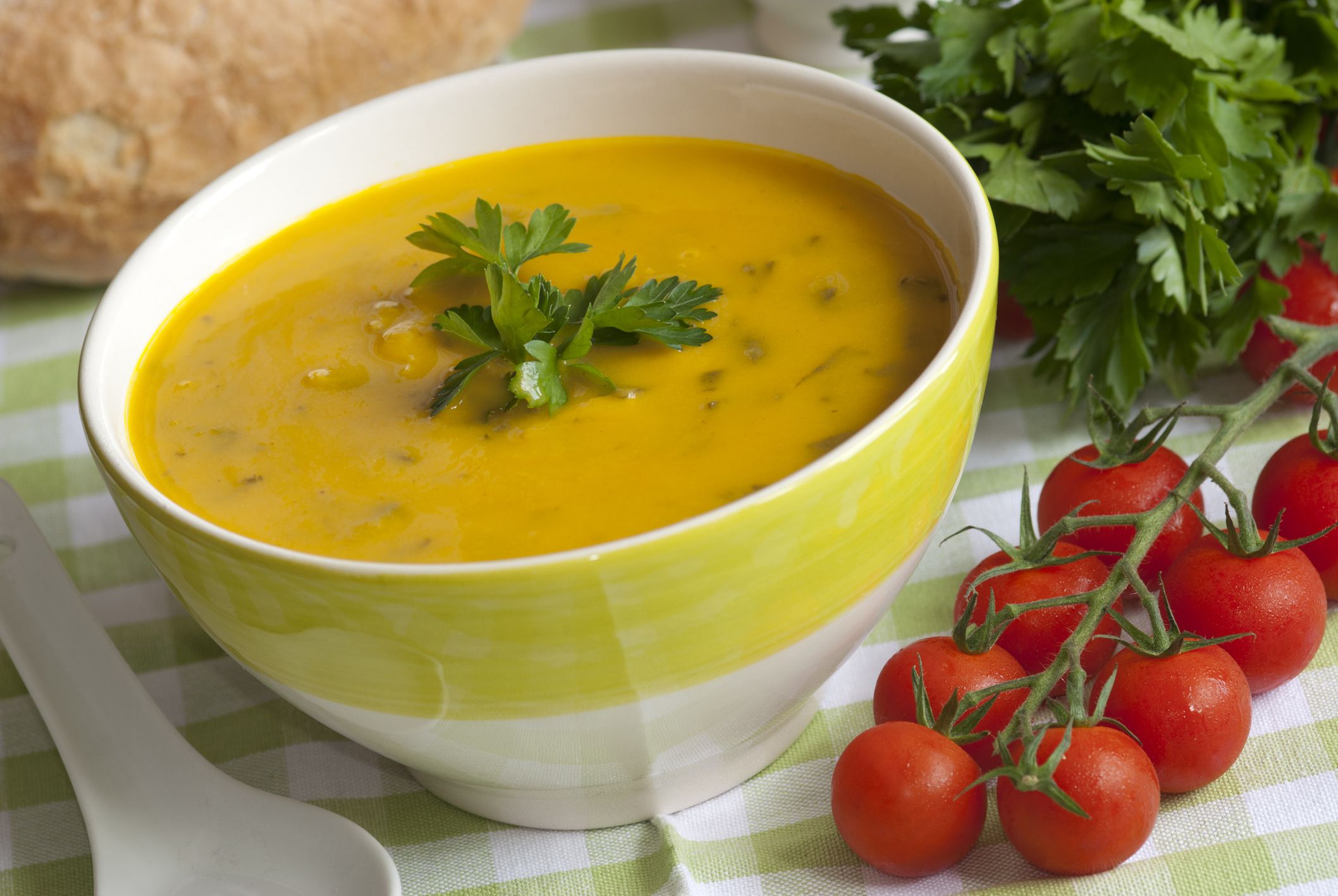Sweet potato, smoked haddock and spinach soup in a bowl