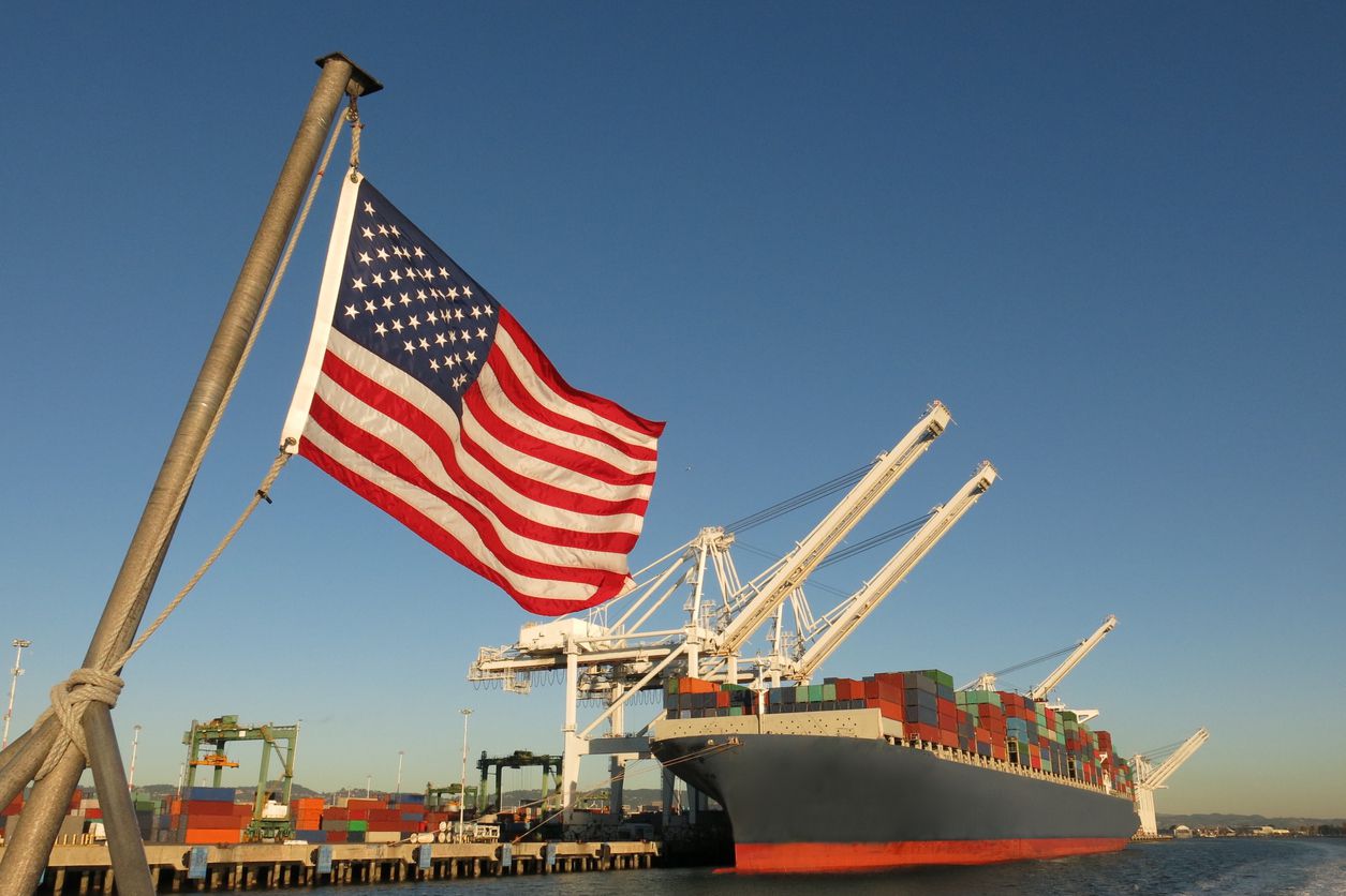 american flag outside shipping containers
