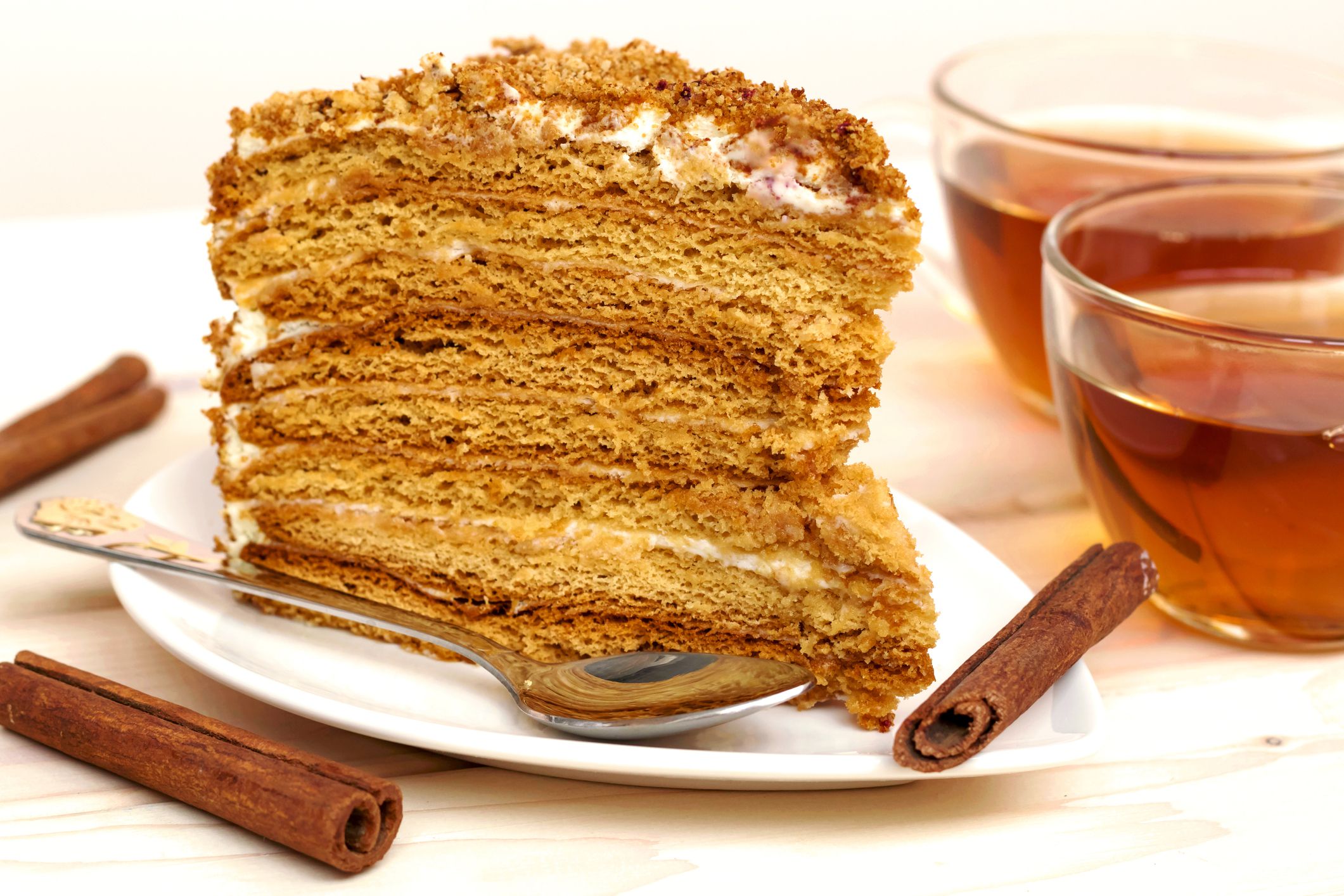 Honey homemade cake with tea and cinnamon. Close up.