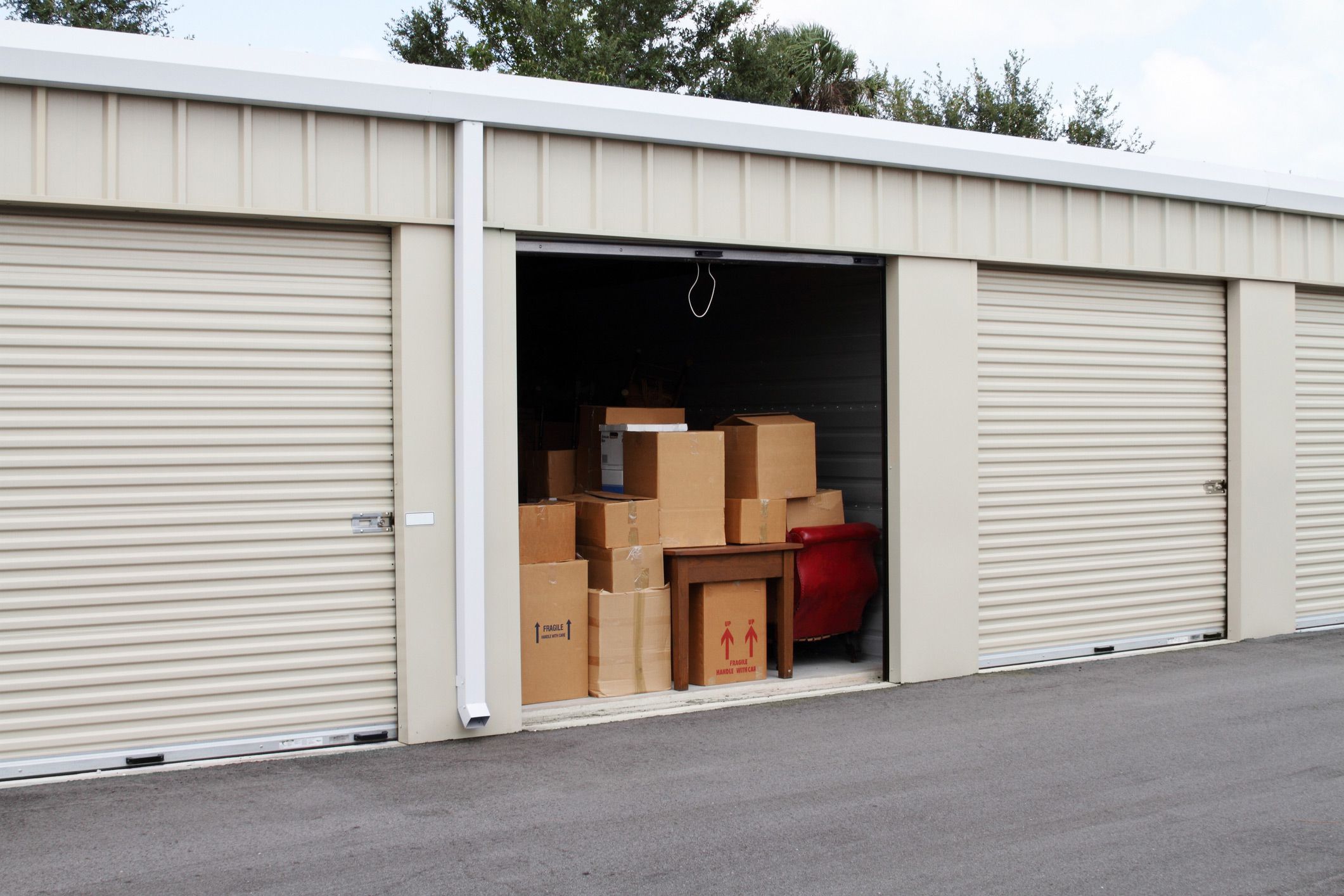 Self storage warehouse with single storage unit open
