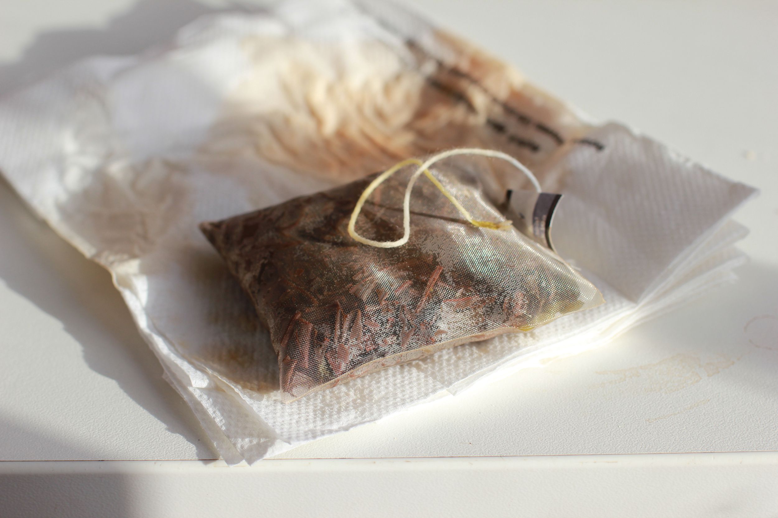 tea bag, used and put on a white napkin
