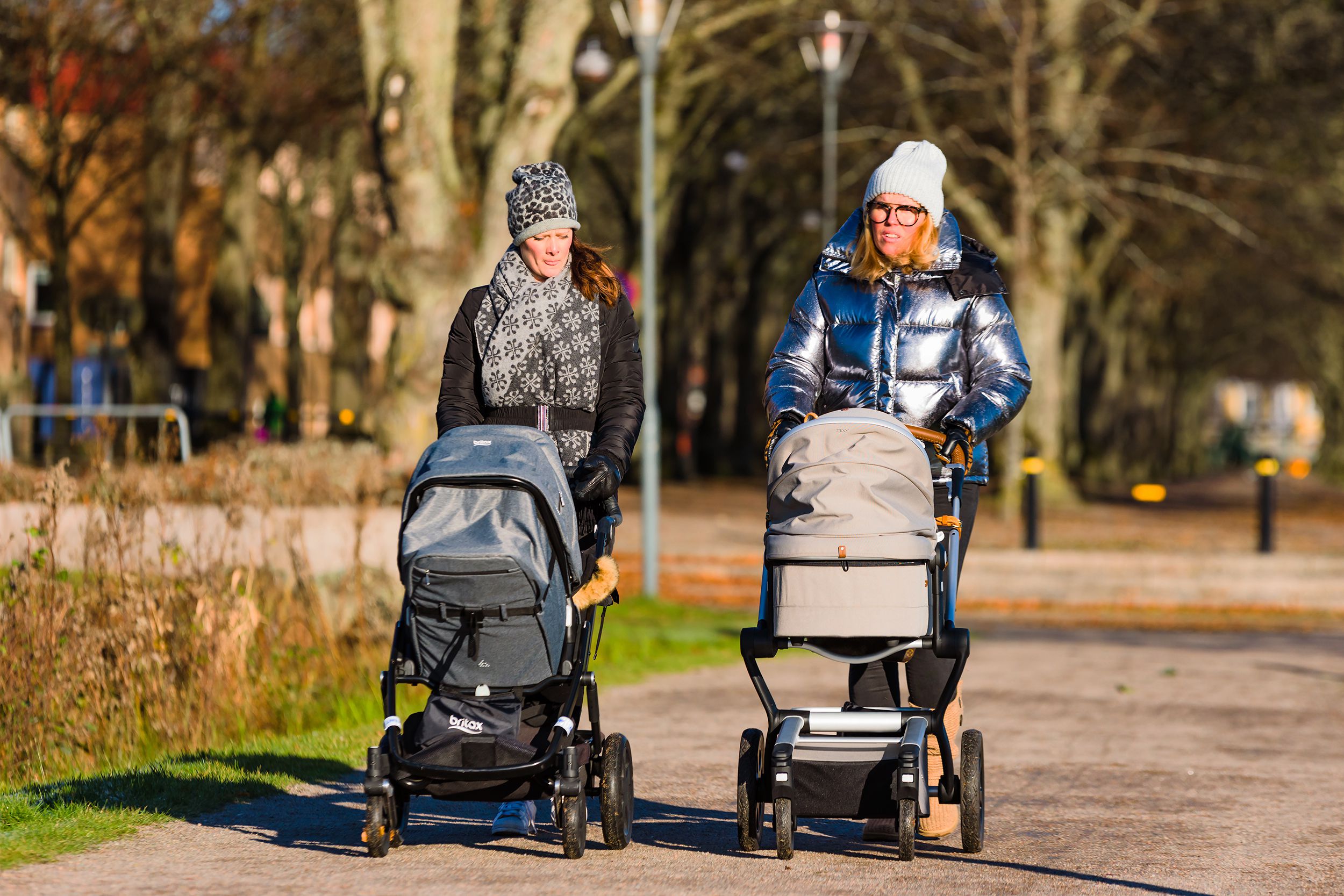 two women out walking with prams on a sunny but cold morning, Sweden