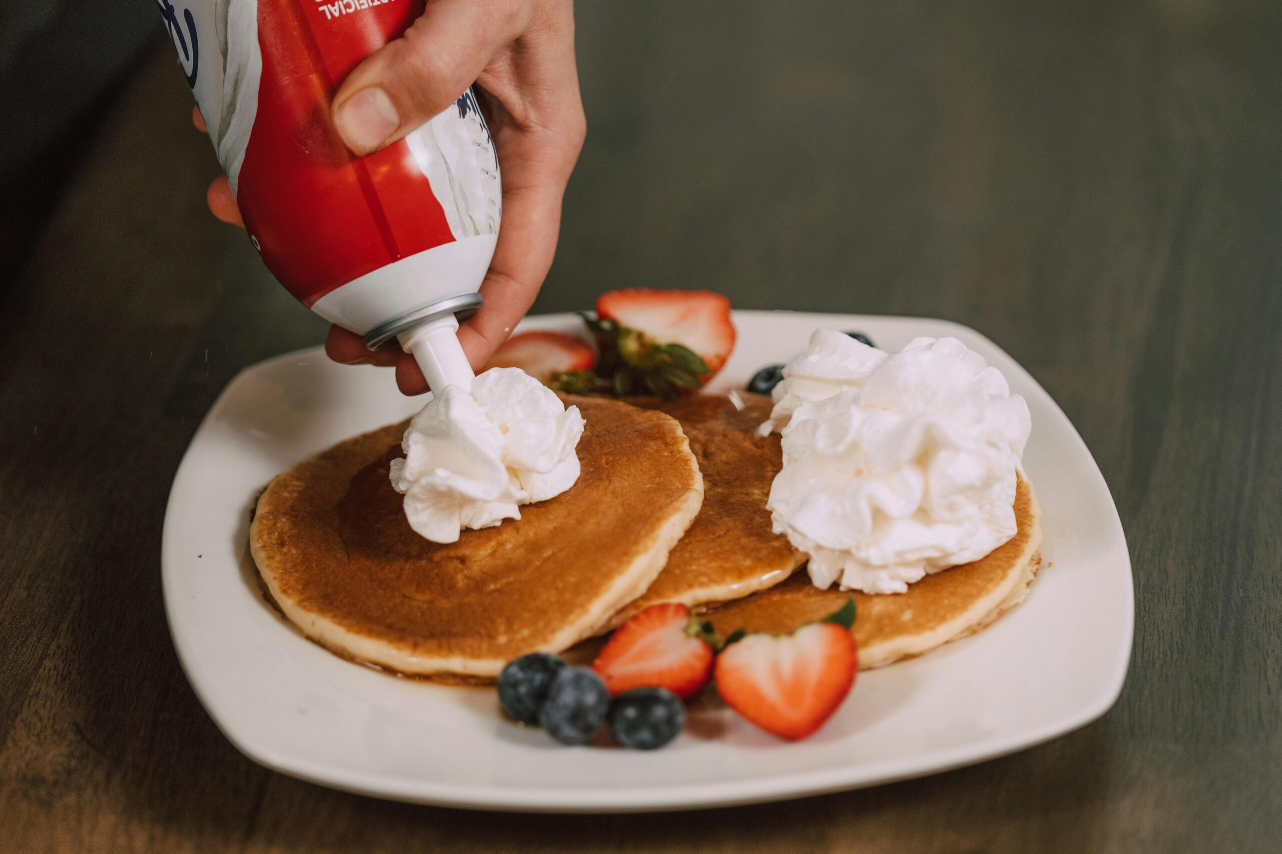 pancakes with fruit and whipped cream