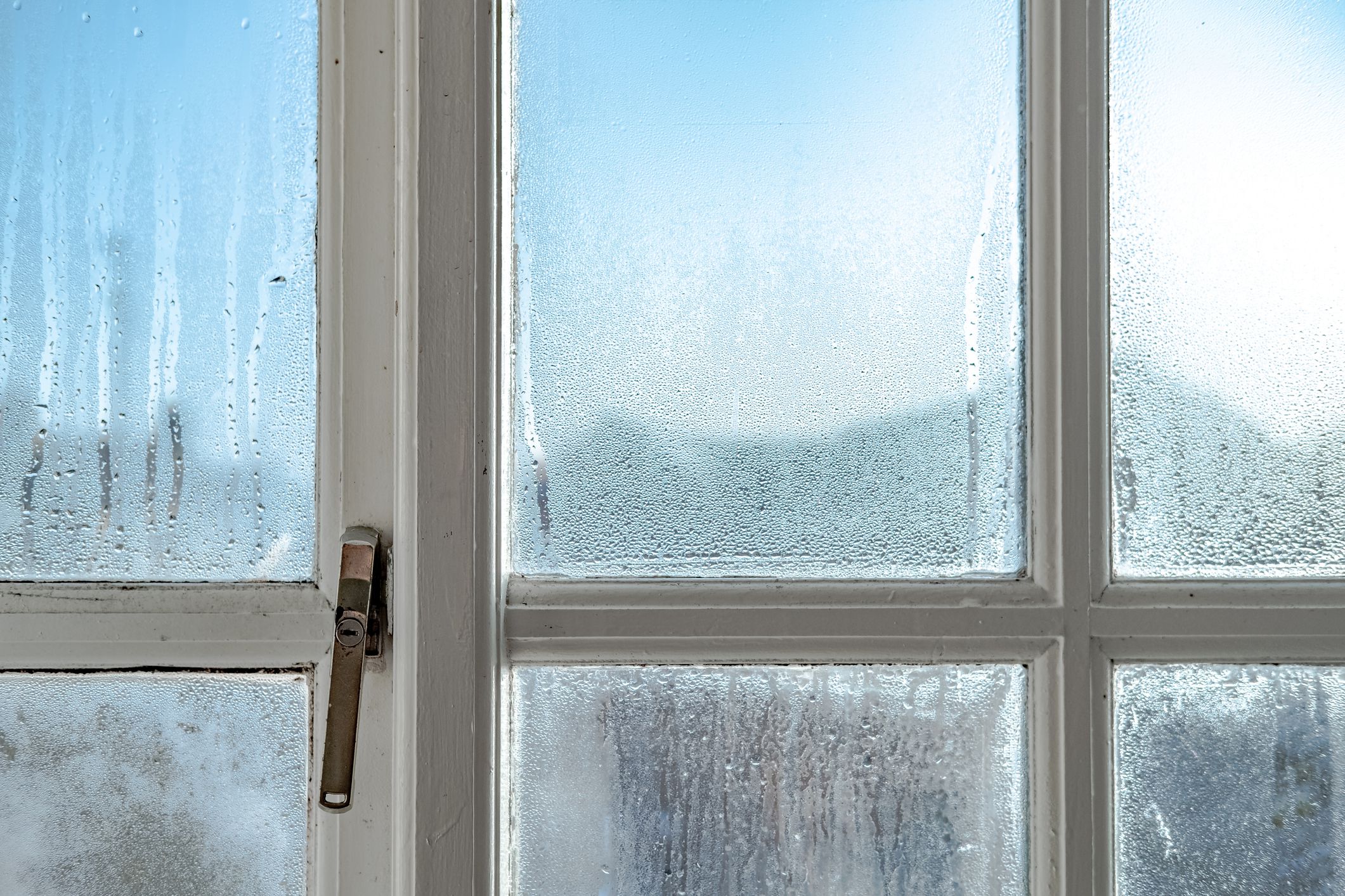 Showing the wooden frame and metal lock, the condensation is known to cause damp and mould.