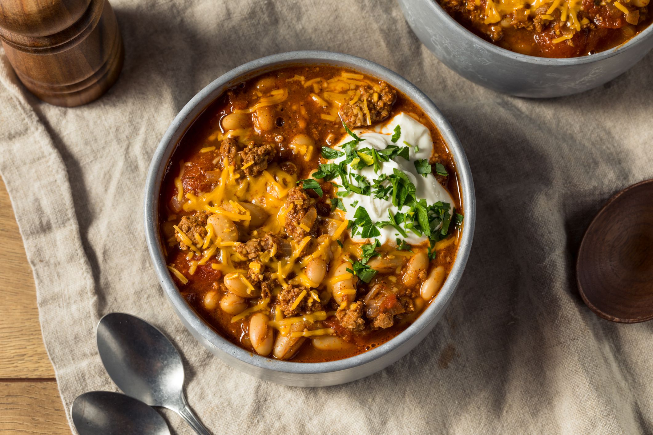 Homemade Turkey Chili Con Carne with Sour Cream and Cheese
