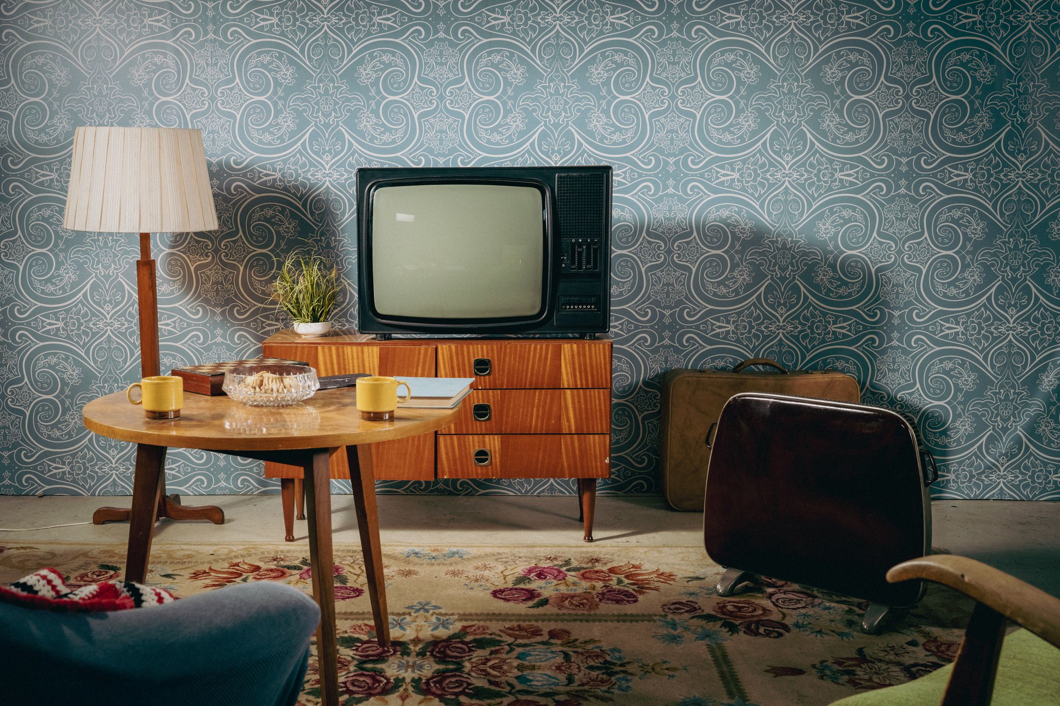 Old television in desk in empty hall.