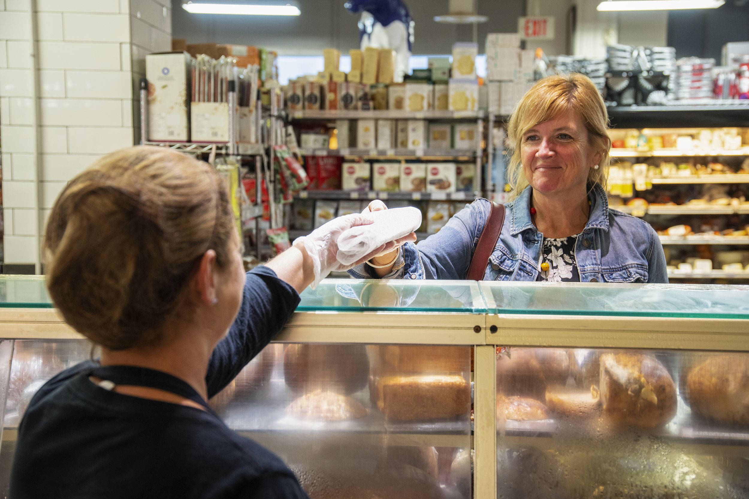 woman customer buying some deli meat