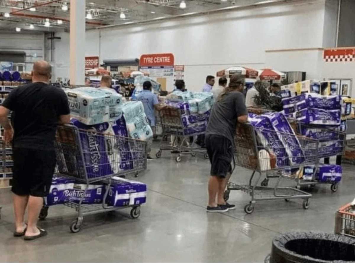 Costco line with carts filled with toilet paper
