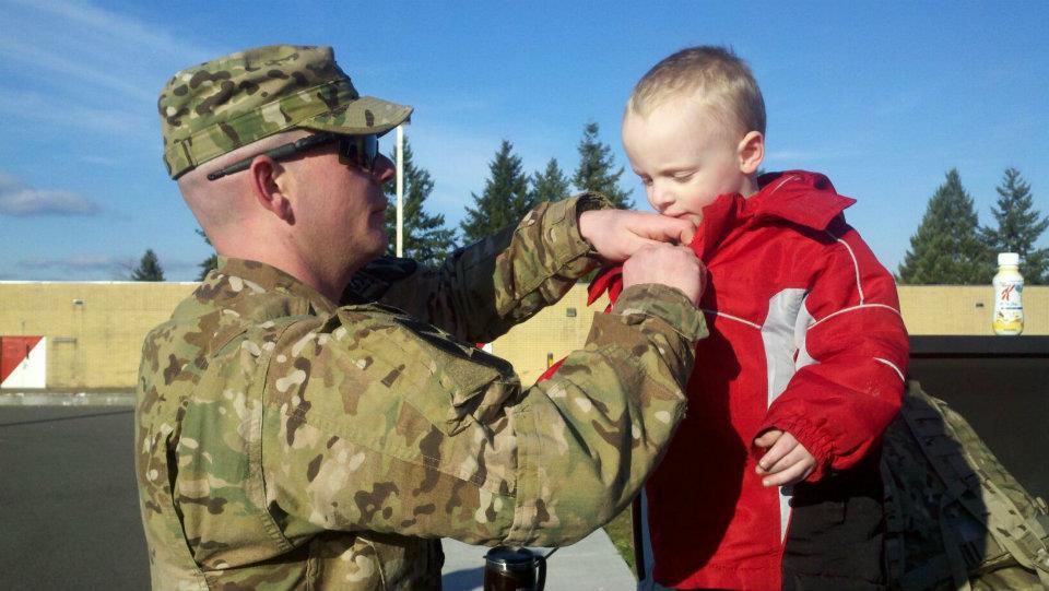 amy soldier saying goodbye to his son before deploying