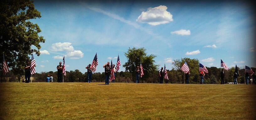 American flag salute at a military funeral