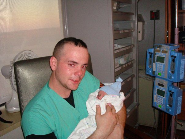 joseph lilly holding his baby for the first time