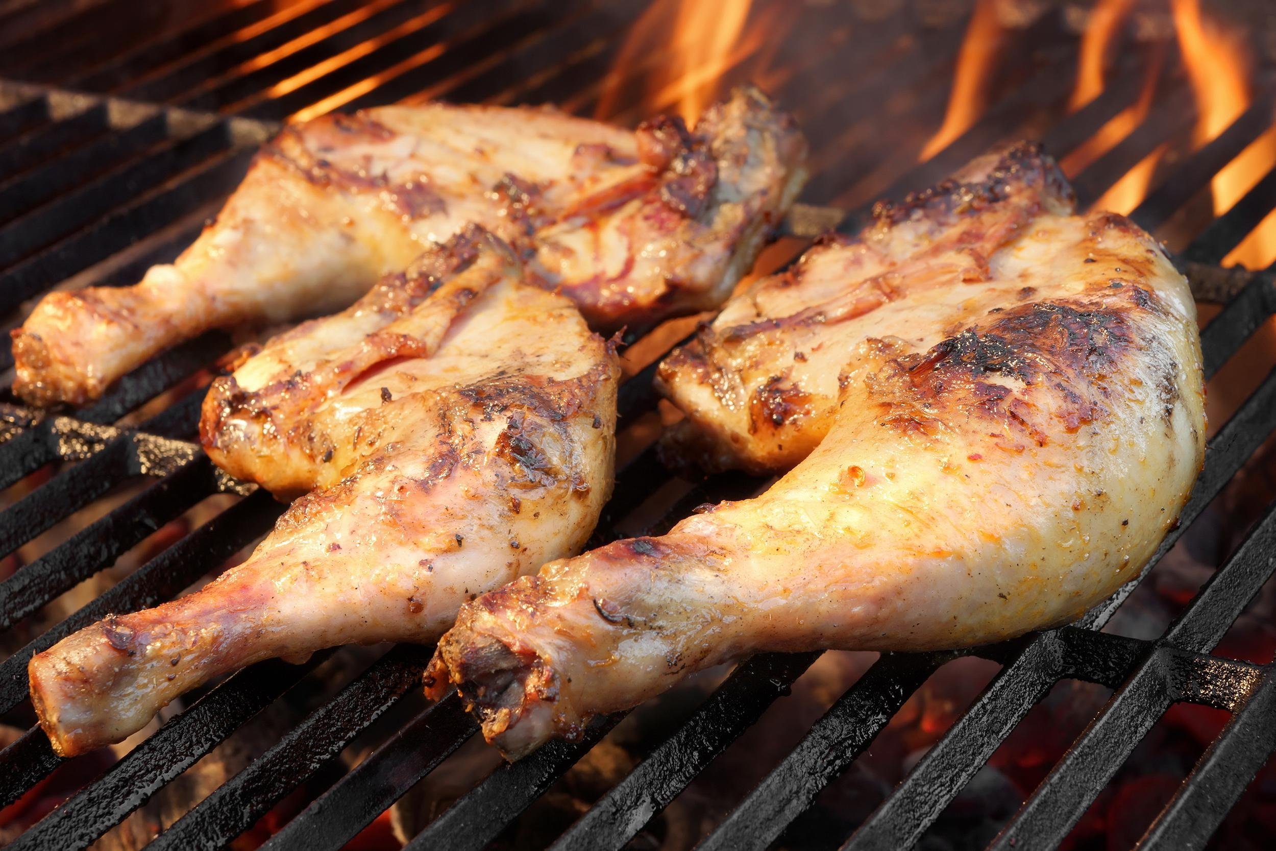 grilled chicken legs on the barbecue grill