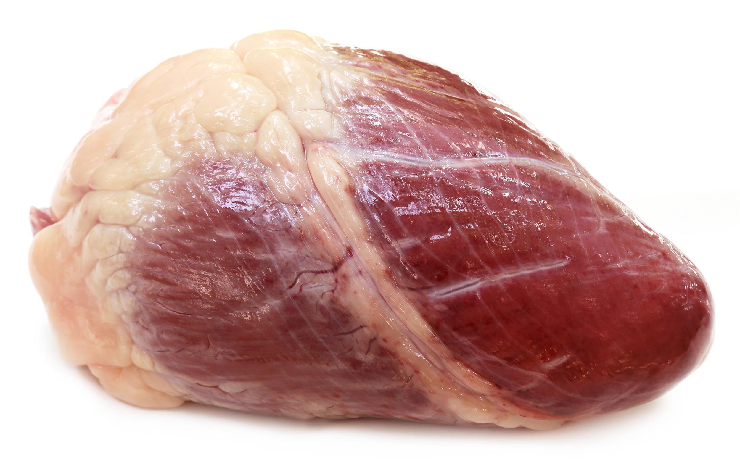 raw beef heart on white background with drop shadow