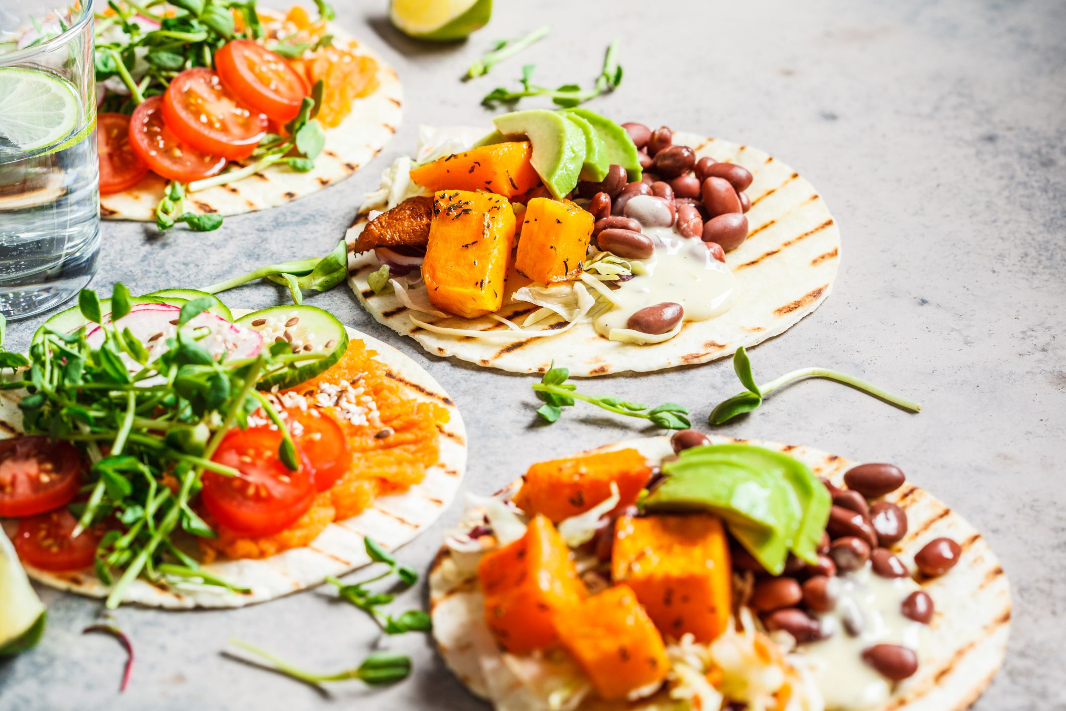 Open Sweet Potato Tacos on a Grey Stone Table