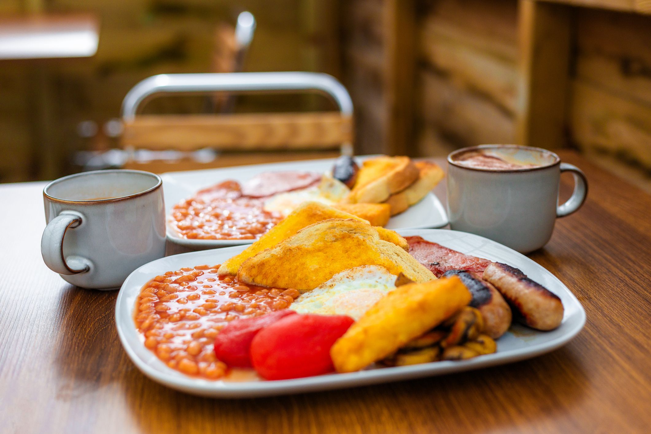 Two Plates of English Breakfast in a Hotel Restaurant, England