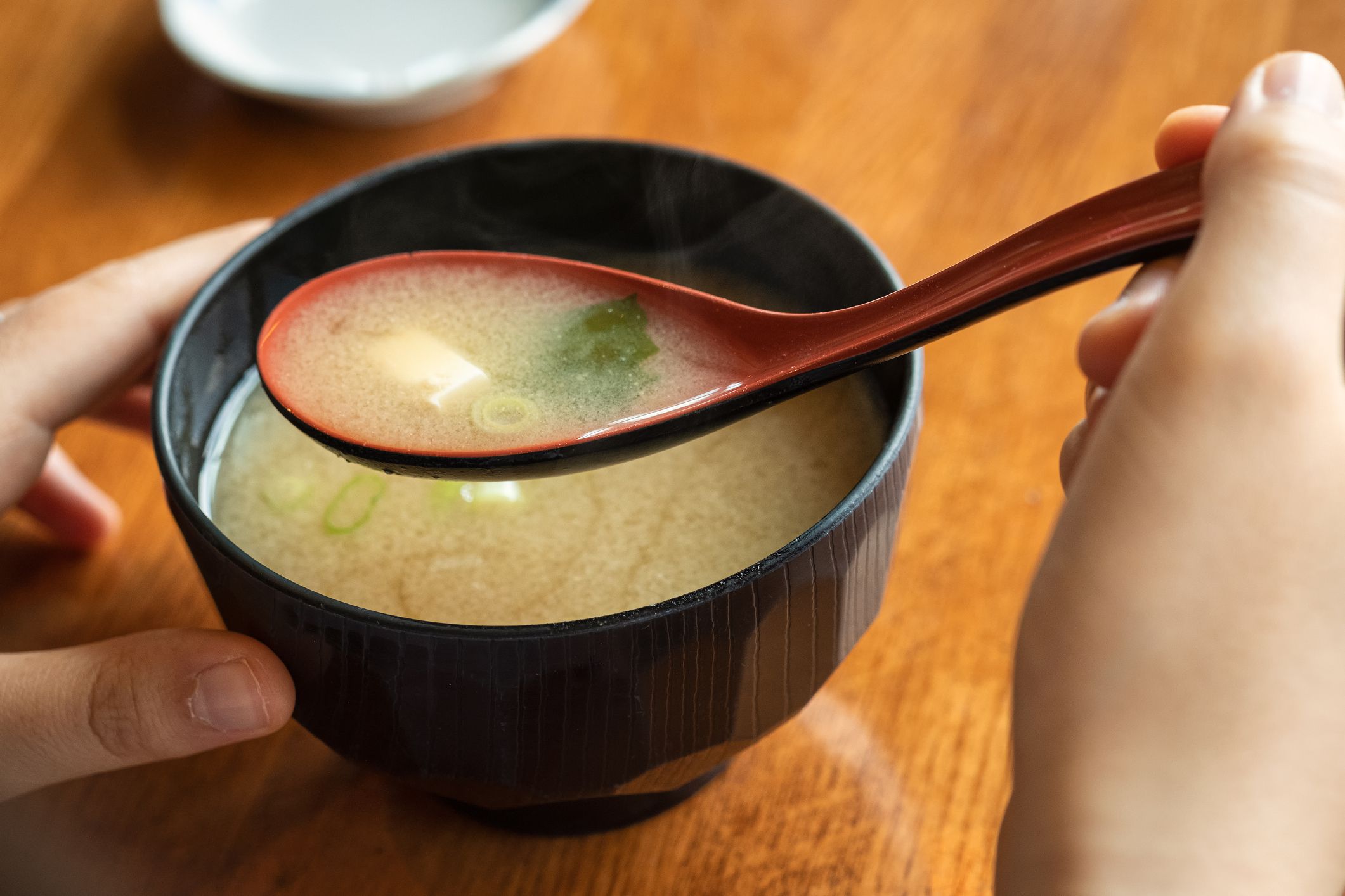 Personal perspective of a diner eating a Japanese meal.
