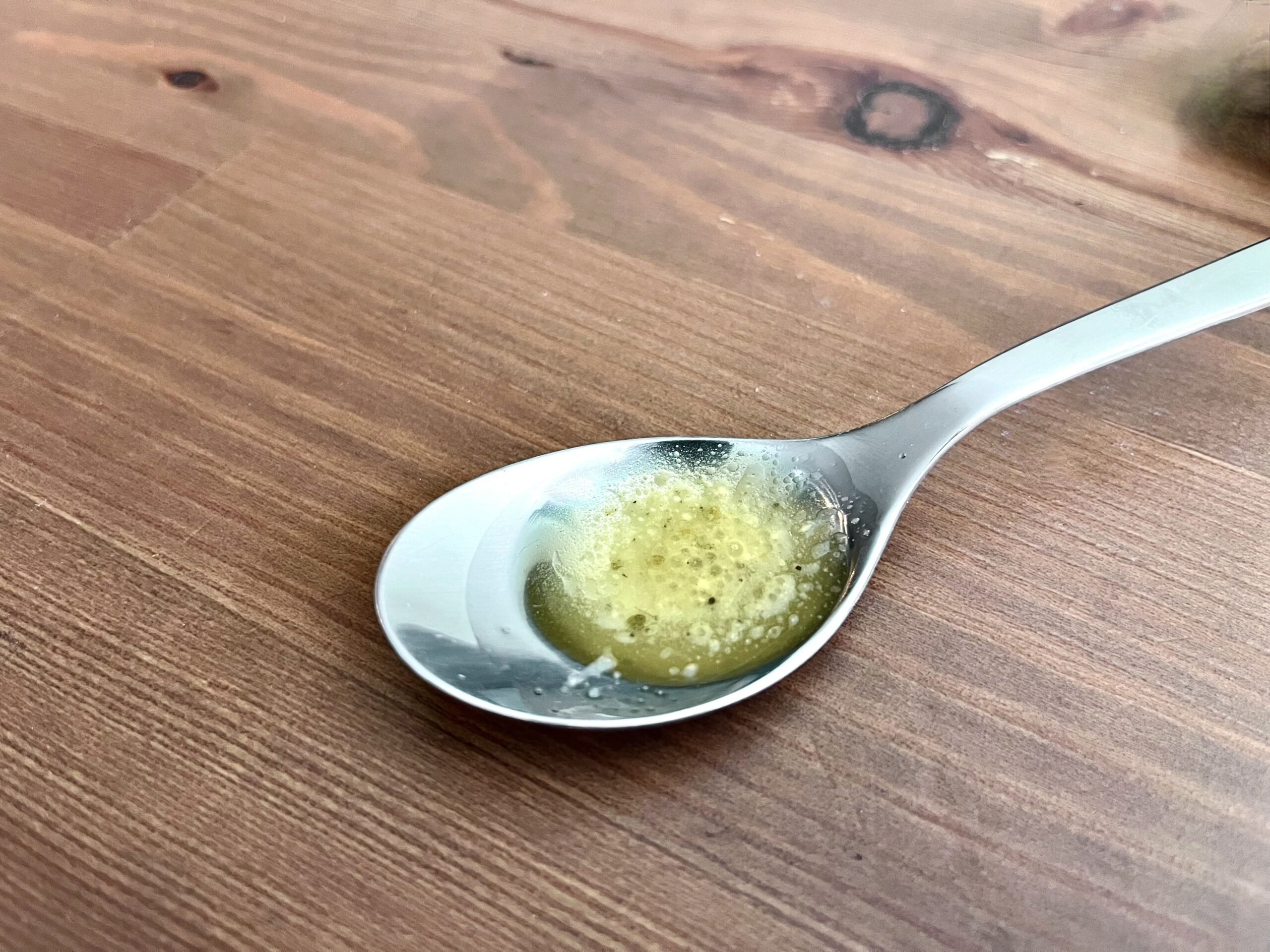 Newman's Own caesar dressing on a spoon