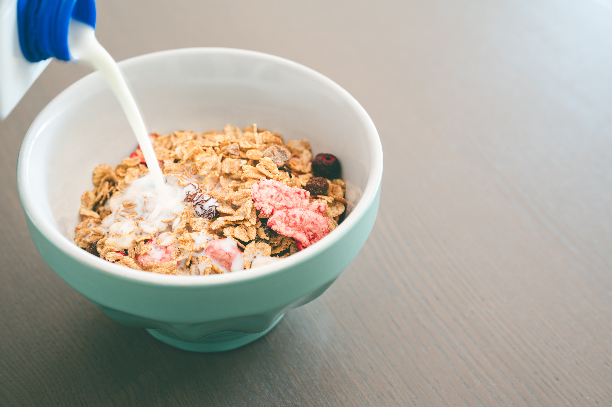 Milk Being Poured Into Cereal