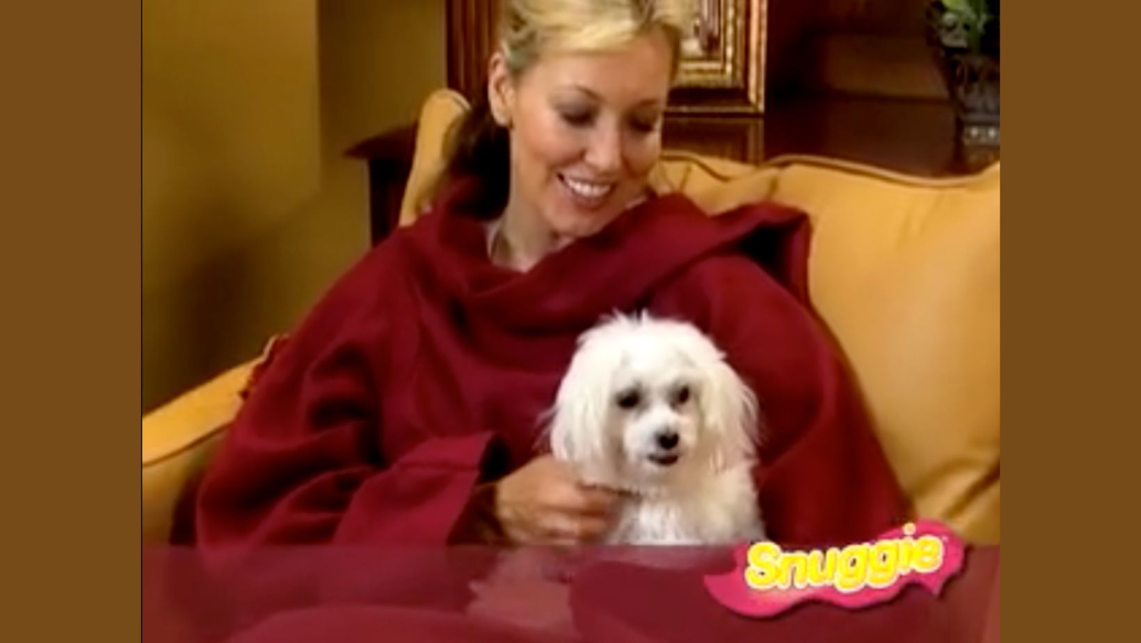 Snuggie Commercial featuring woman holding a dog