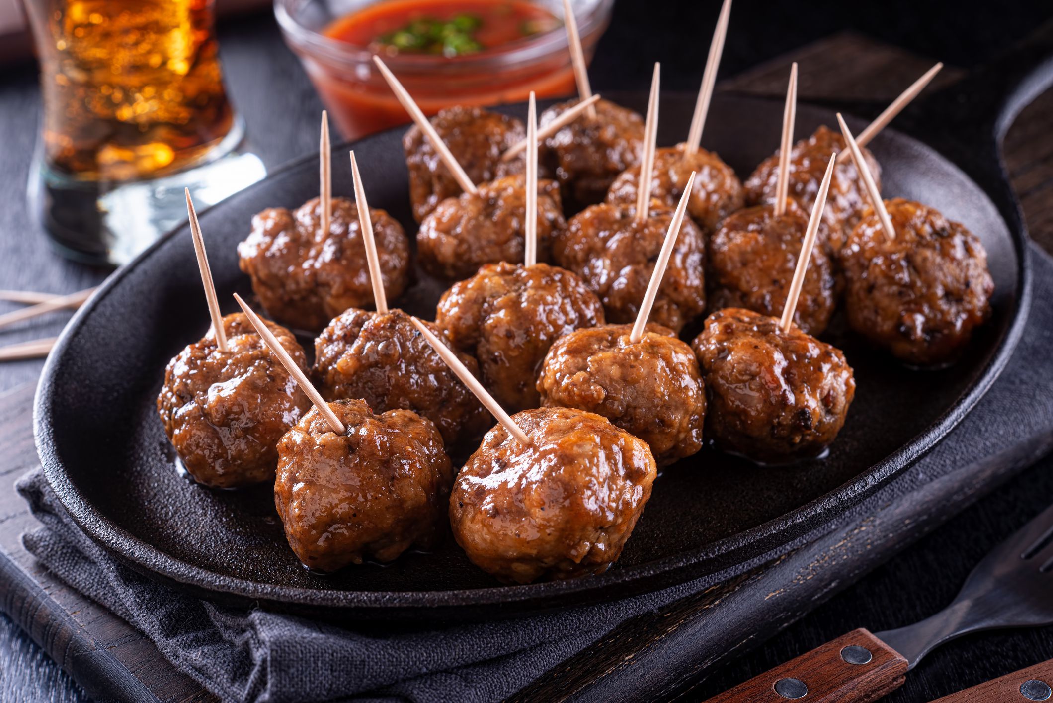 A platter of delicious sweet and spicy meatballs.