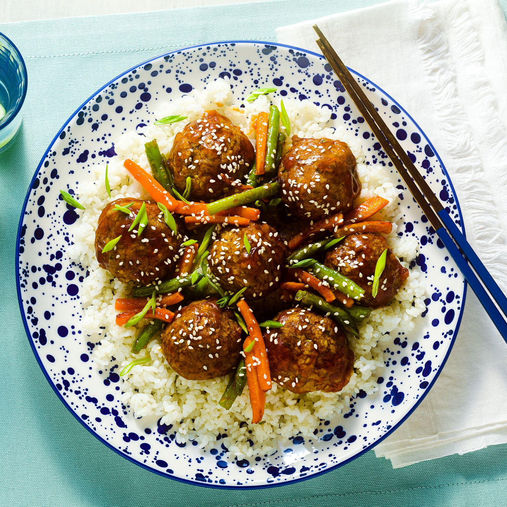 meatless vegan Asian meatballs in sweet and sour sauce with rice and stewed vegetables. balanced lunch or healthy dinner. street food
