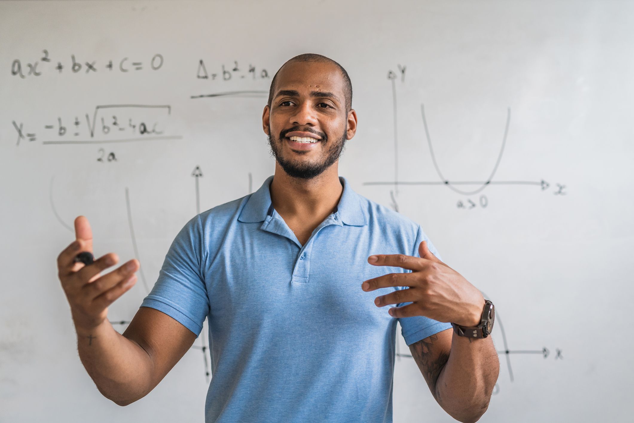 Enthusiastic math teacher in the classroom