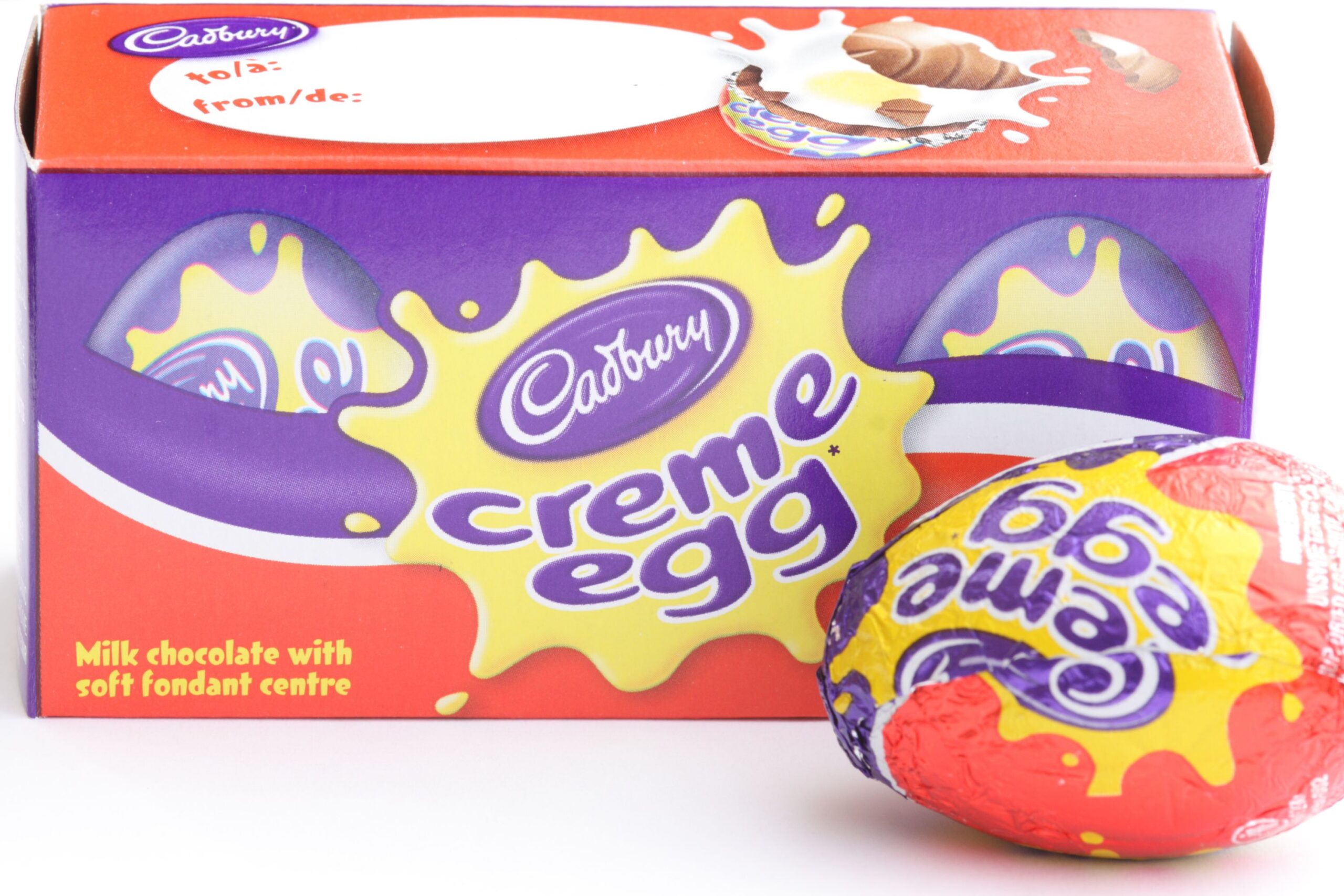 Kitchener, Ontario, Canada - March 20, 2011: A box of Cadbury Creme Eggs with one sitting out front. This Easter chocolate is available each year but only for a limited time.