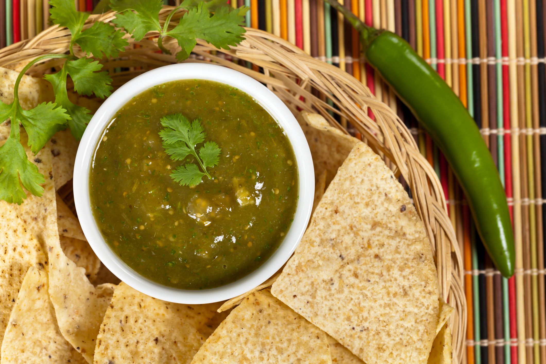Fresh Homemade Salsa Verde with tortilla chips. Selective focus.