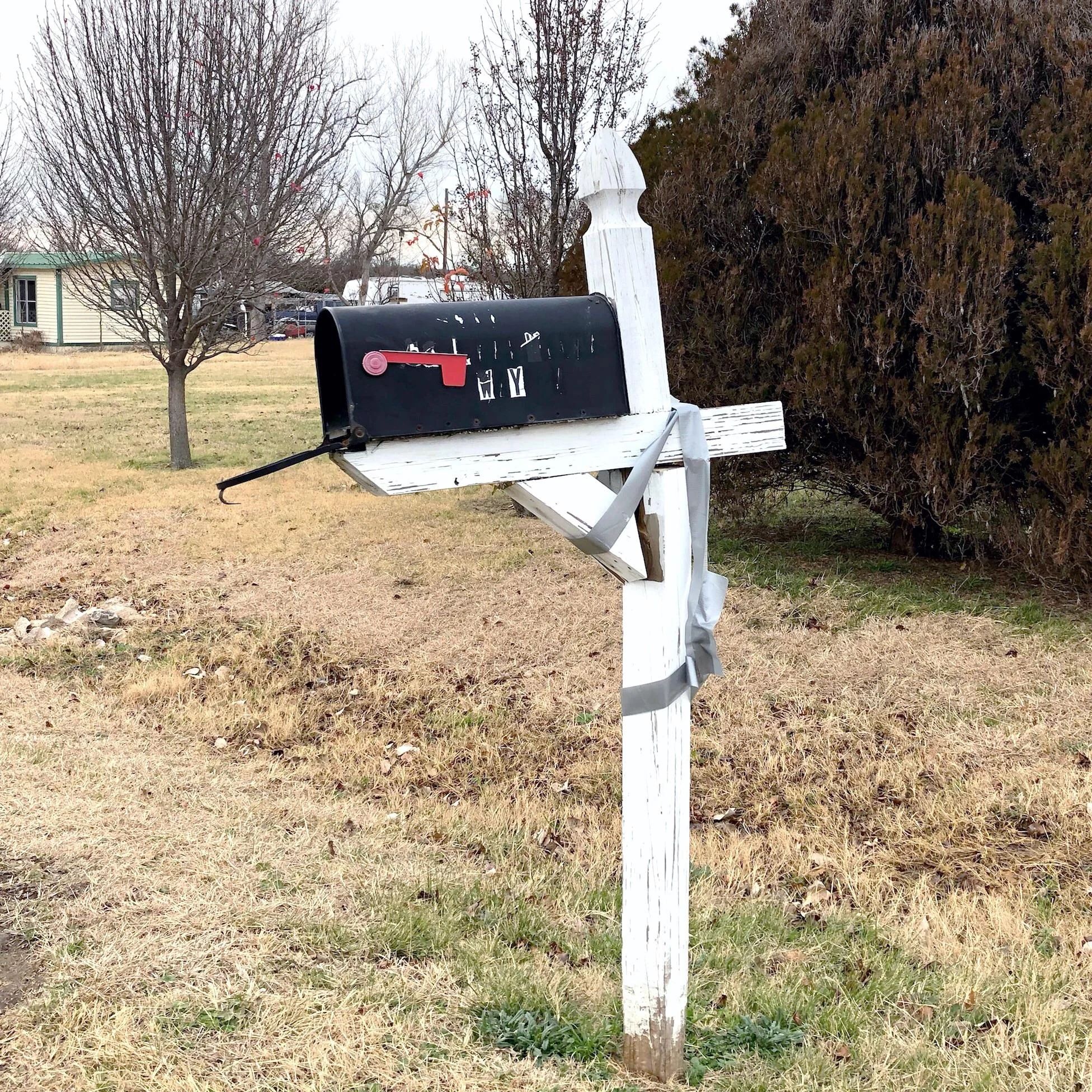 A broken mailbox fixed up with duct tape from Reddit