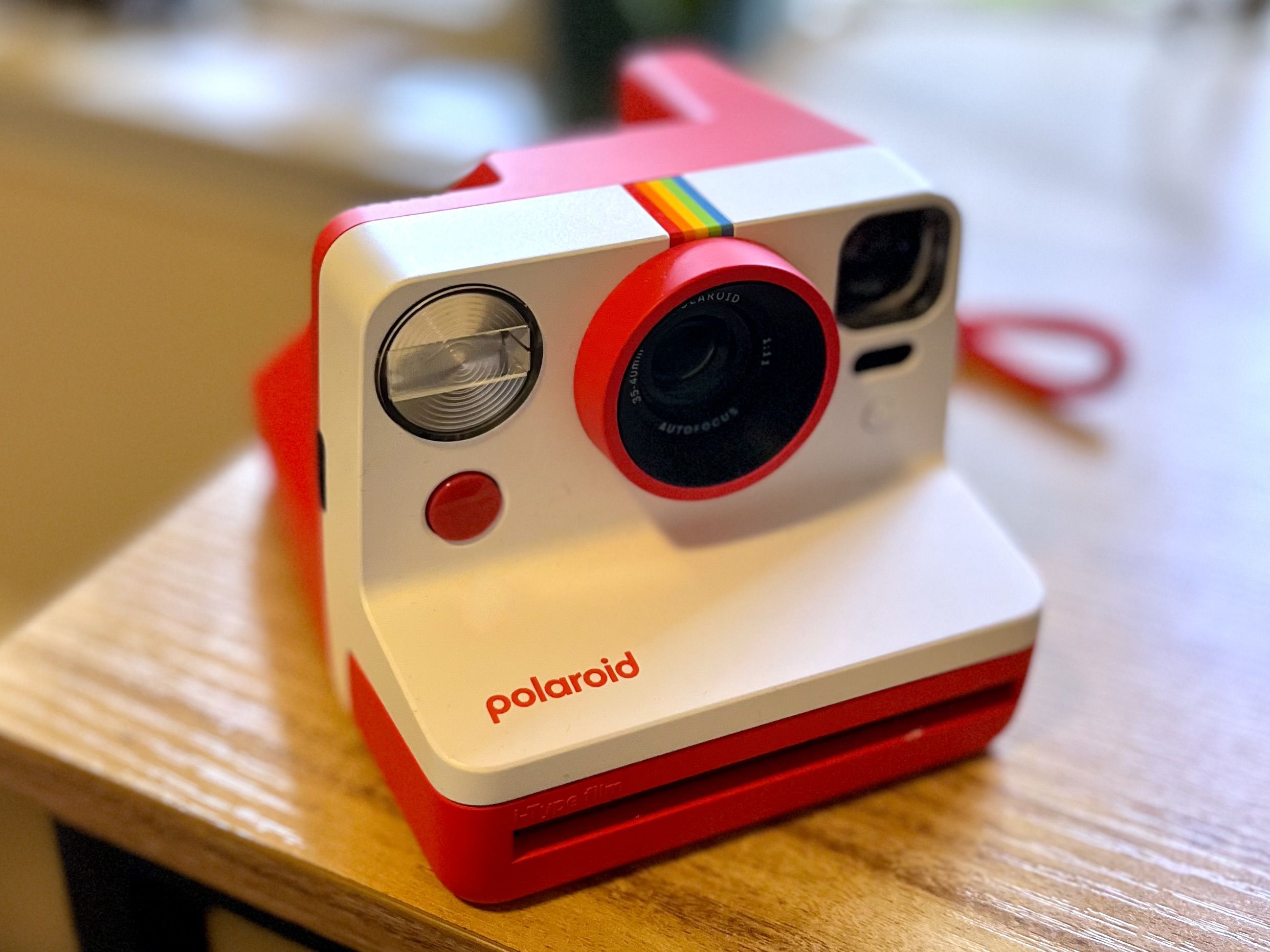 A red Polaroid camera