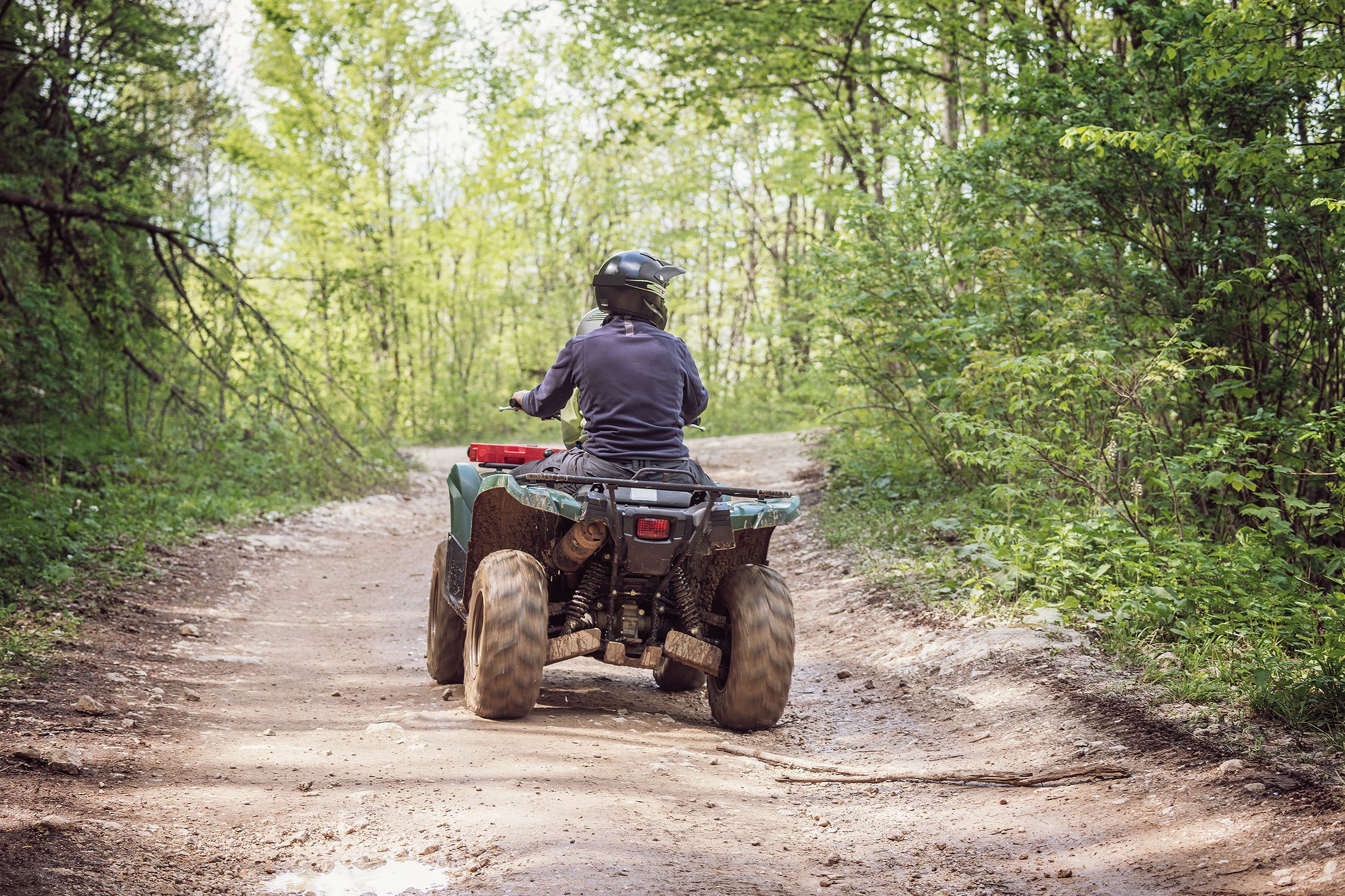 man on the ATV Quad Bike on the mountains road