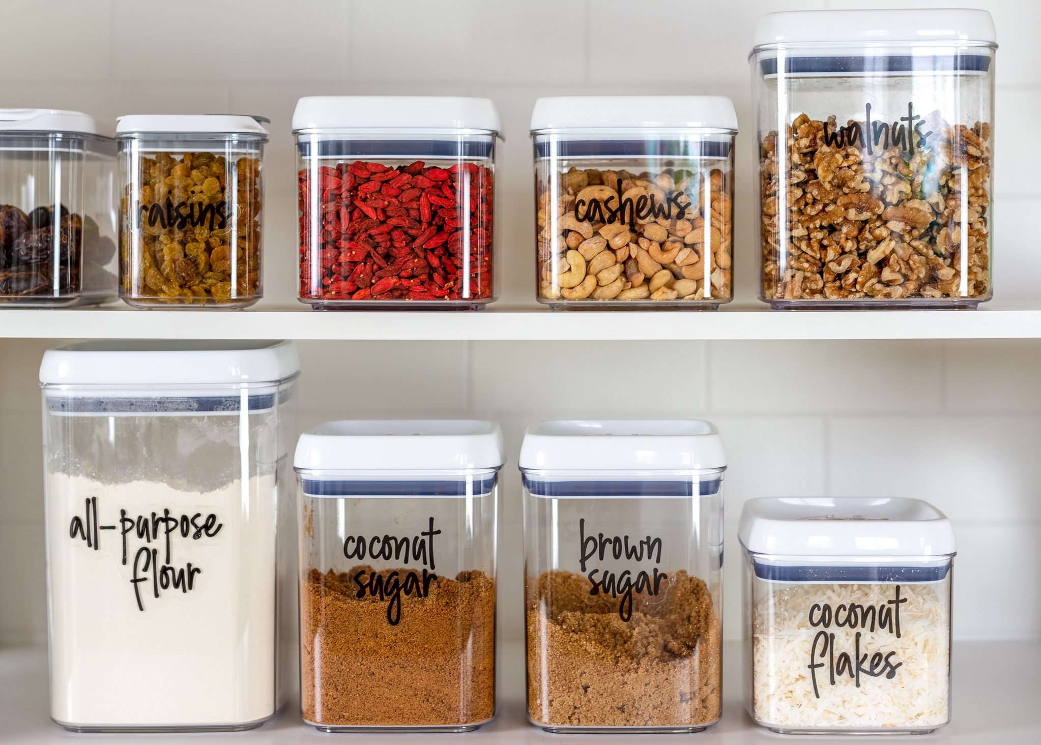 Stored Food in an Organized Pantry on Two Shelves