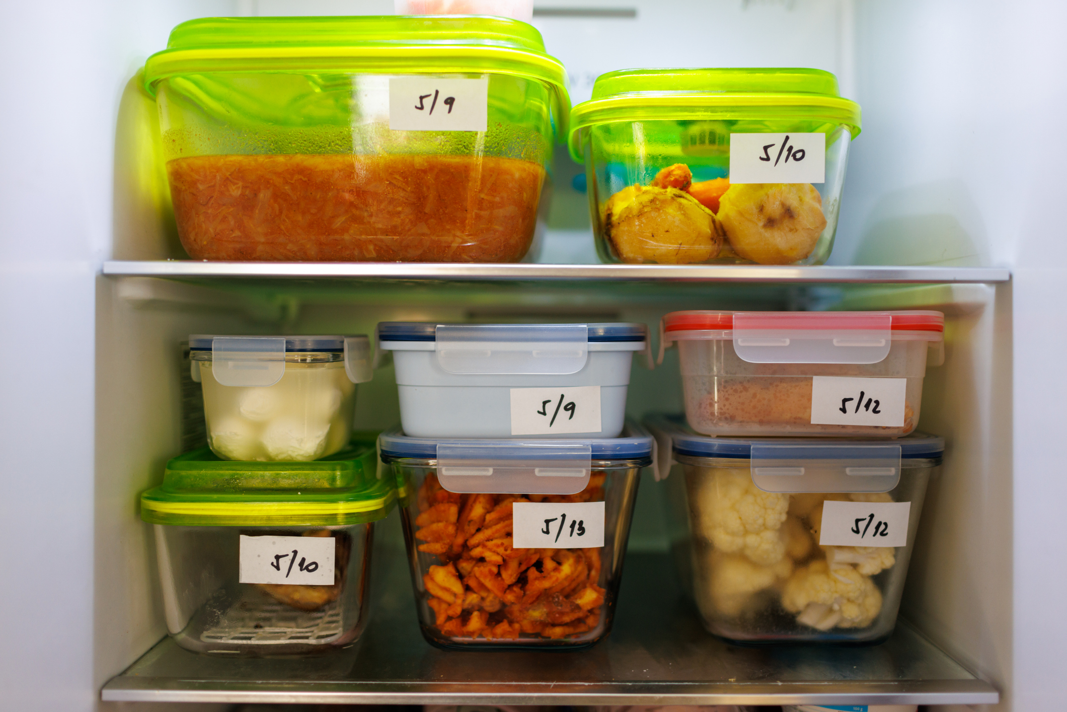 Food Leftovers Packaged in Boxes Inside a Refrigerator