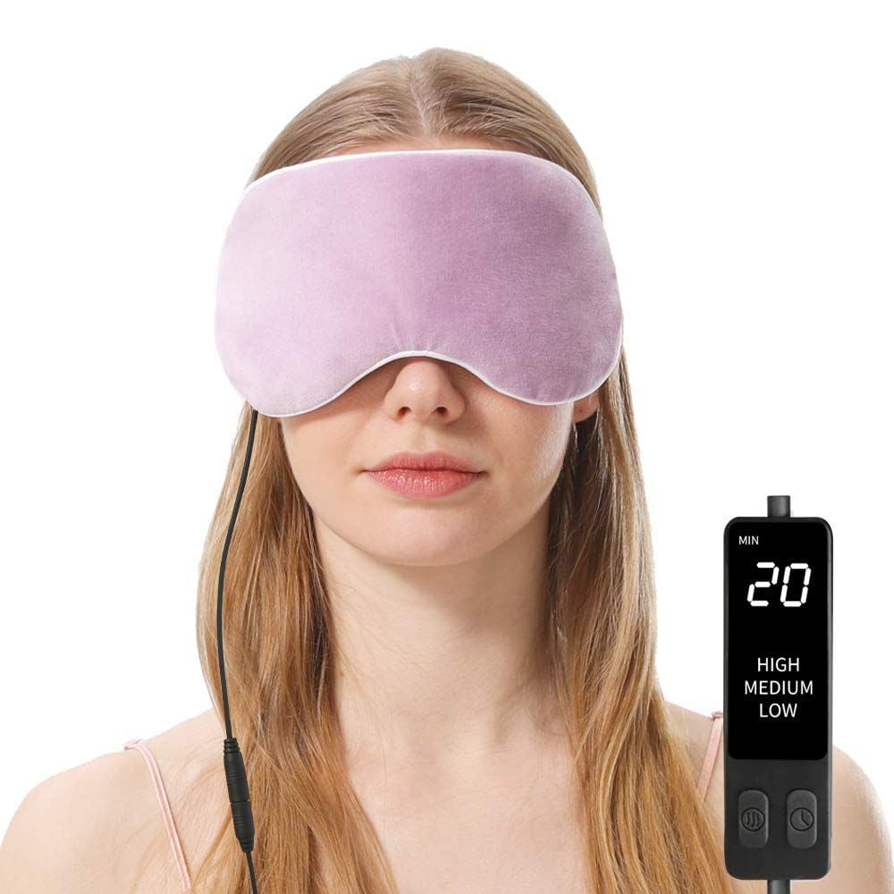 a woman in an eye mask