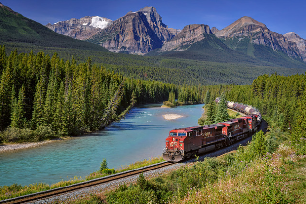A train driving through the mountains of Canada
