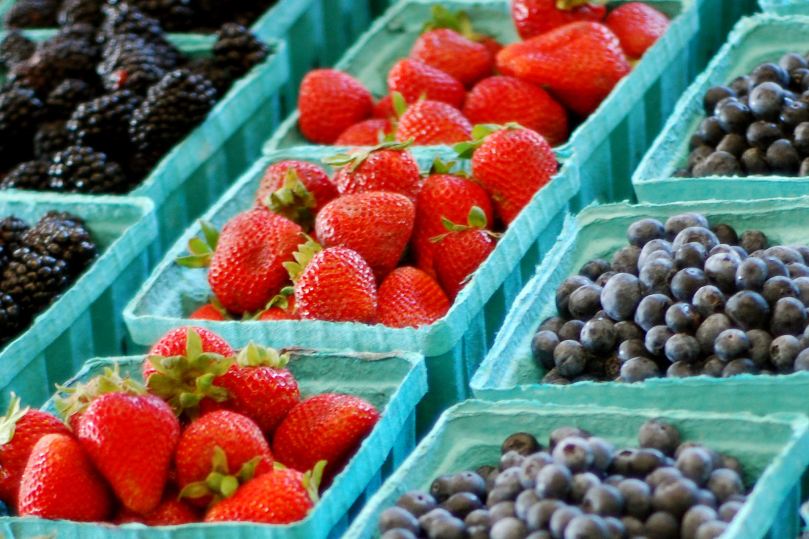 Closeup of Batches of Berries for Sale at a Farmer's Market