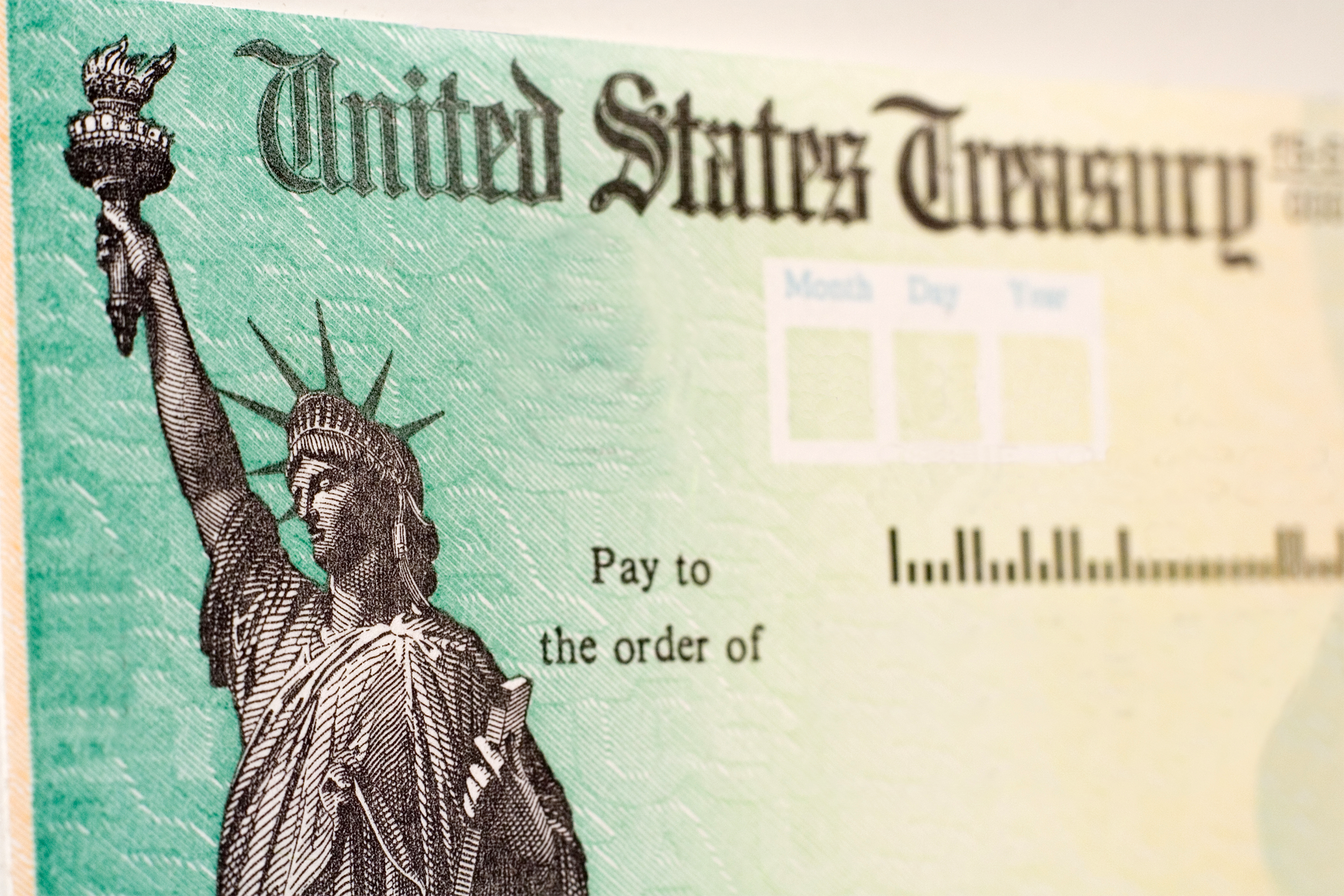 Closeup of U.S. Treasury check, blurred to the right