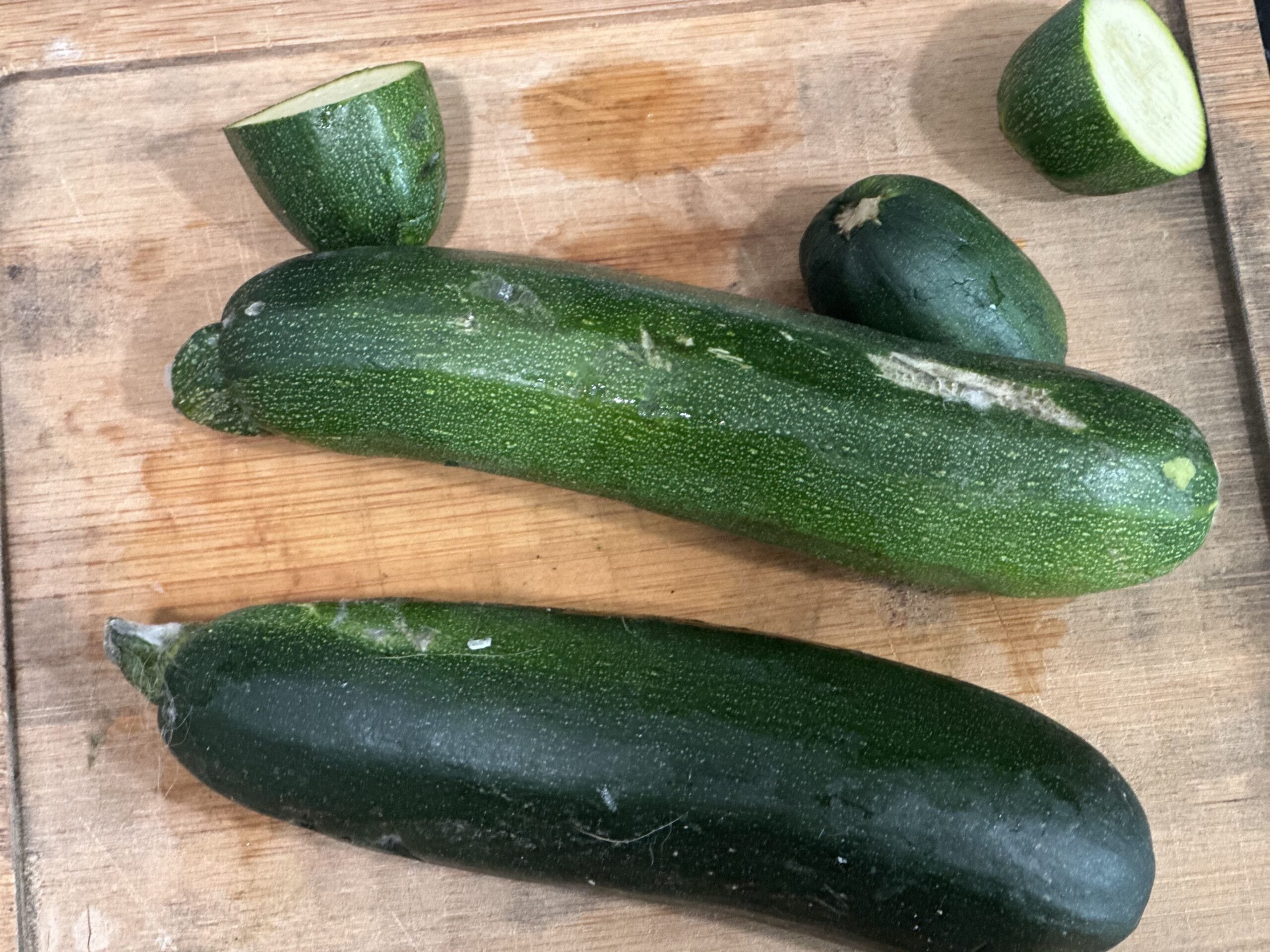 two zucchini on a cutting board