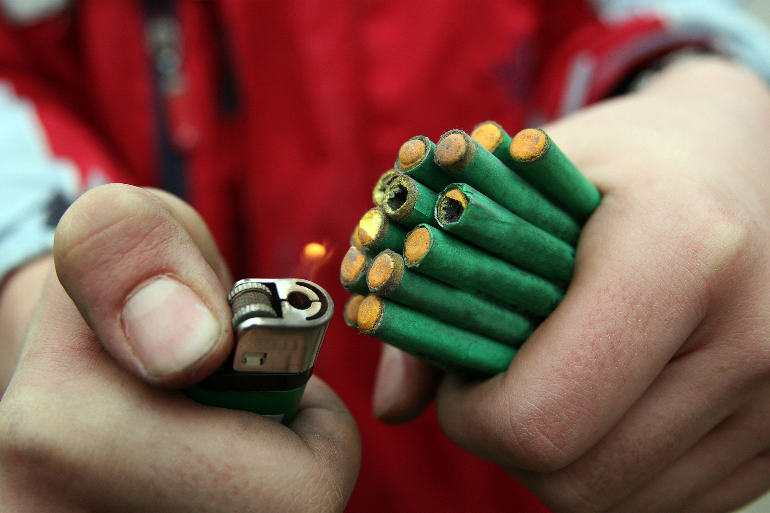 Man lighting firecrackers