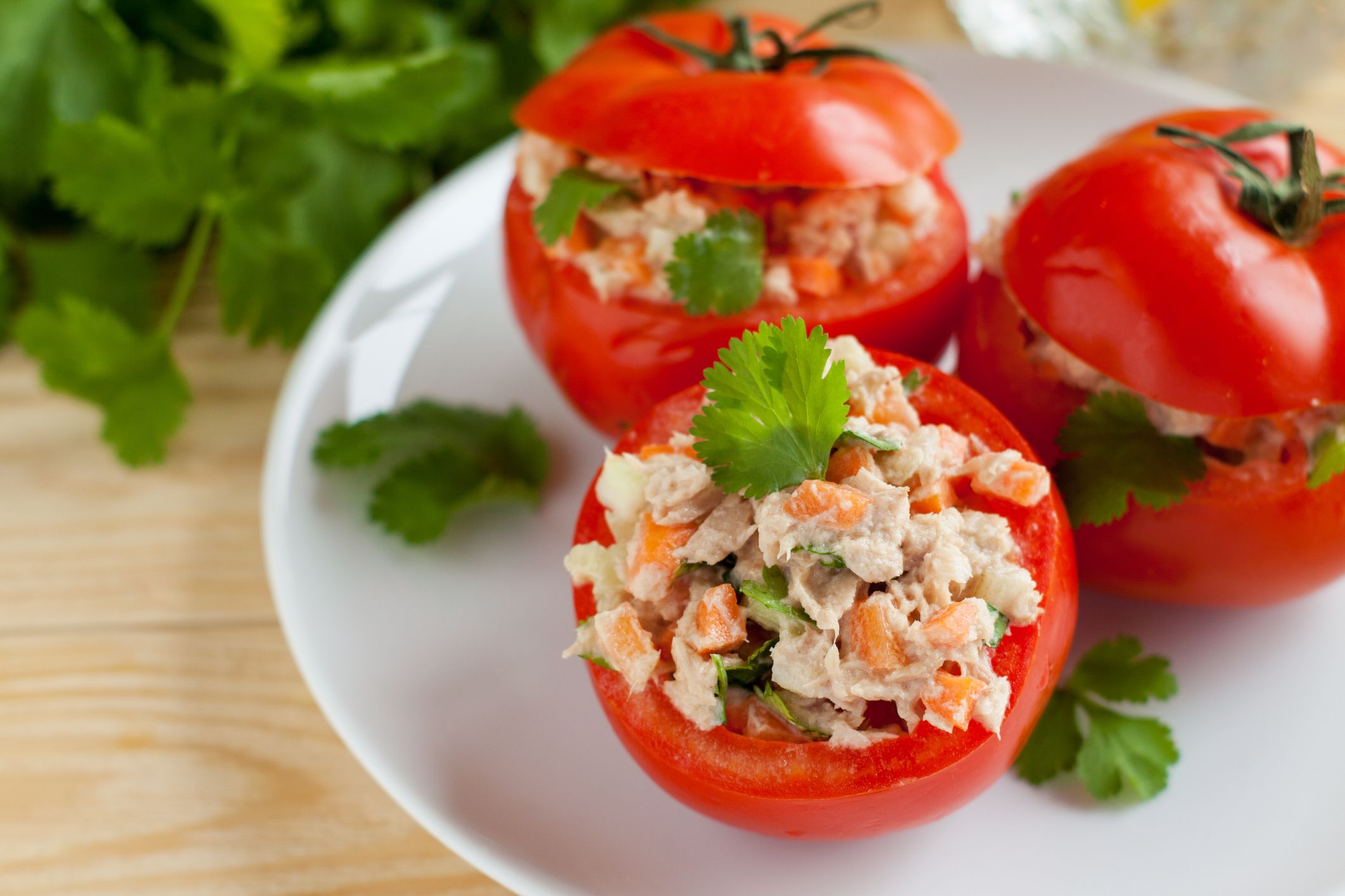 Fresh ripe tomatoes stuffed with canned tuna and vegetables