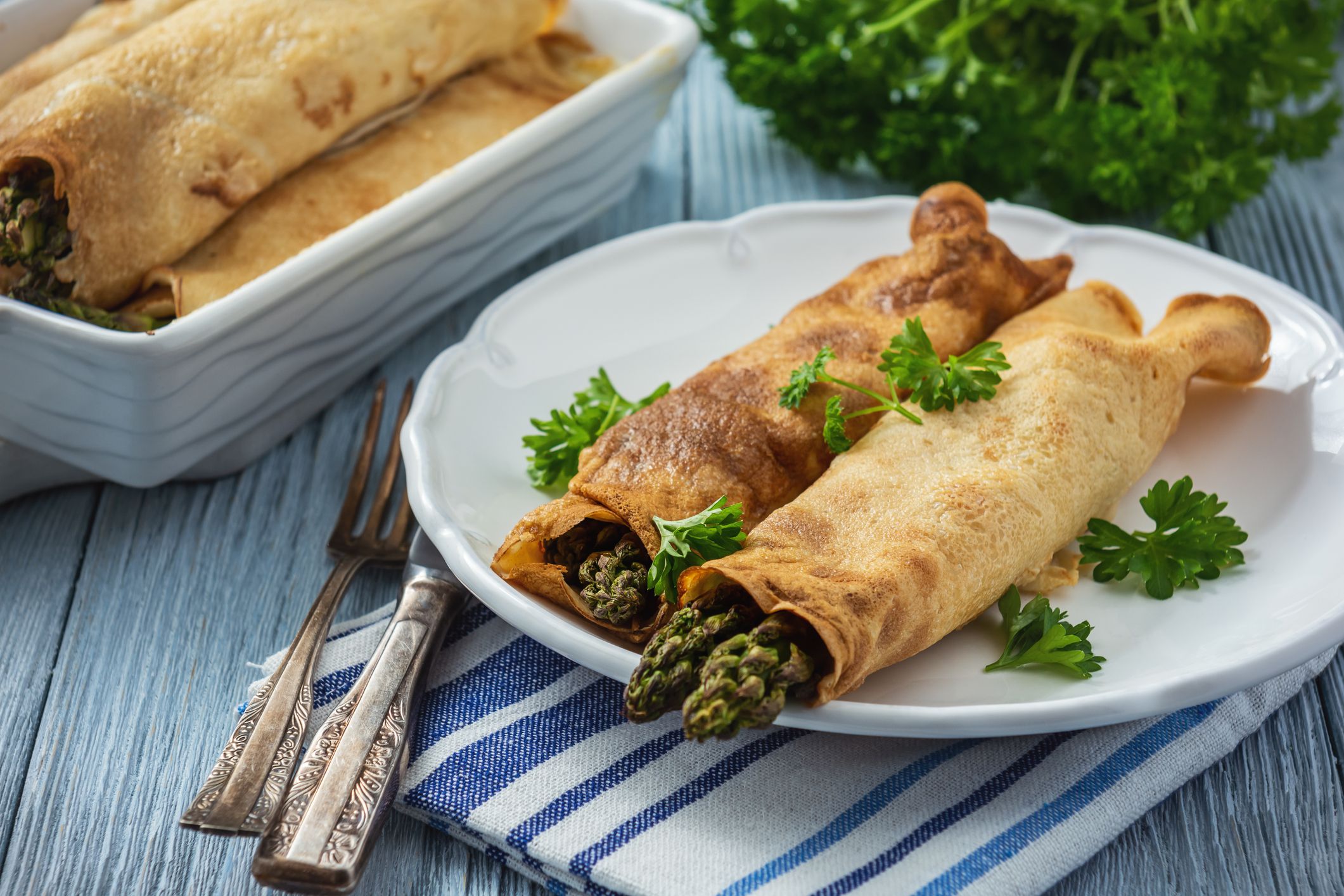 Asparagus and ham stuffed pancakes, baked on oven.