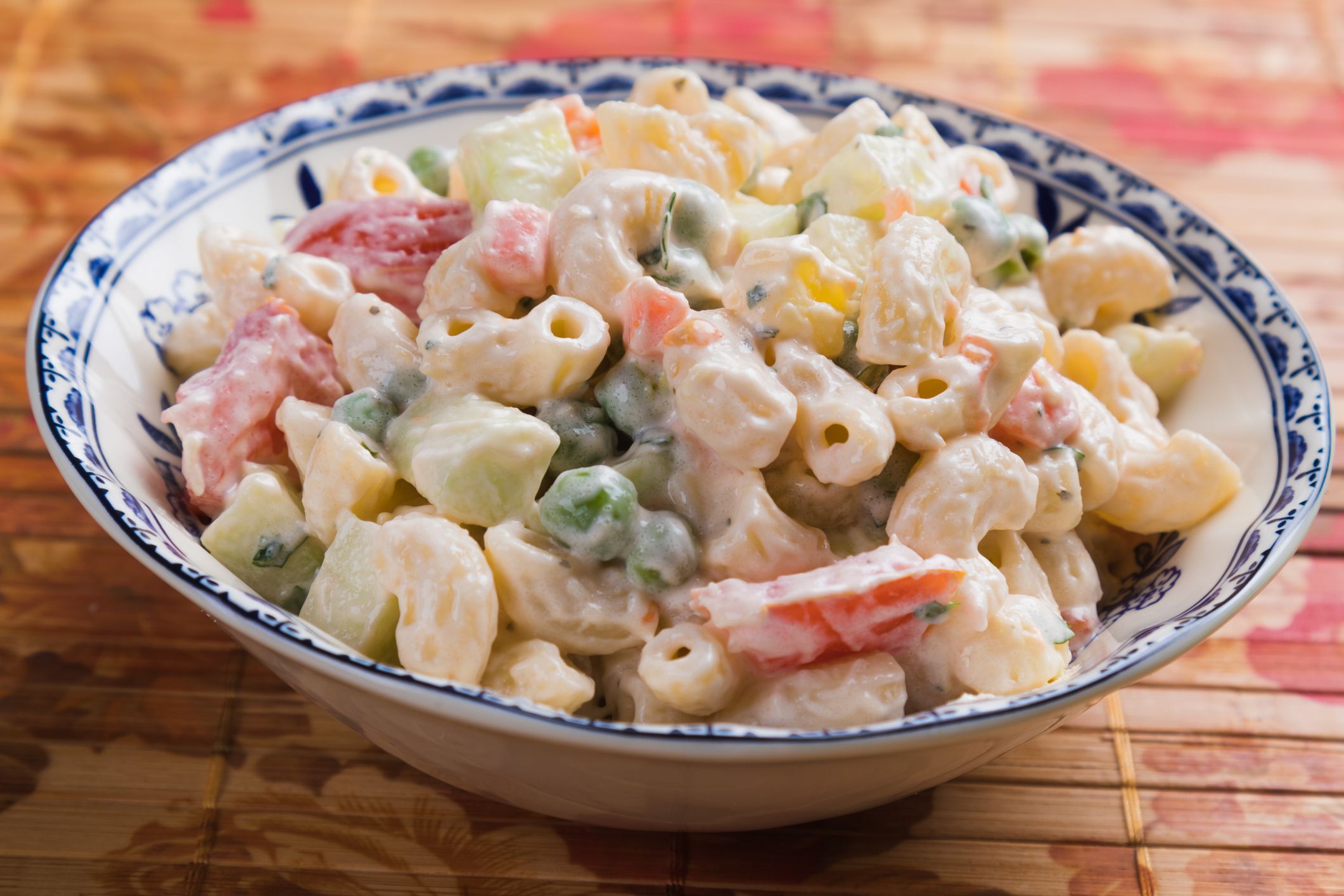 Homemade macaroni salad with elbow pasta, vegetables and mayonnaise dressing
