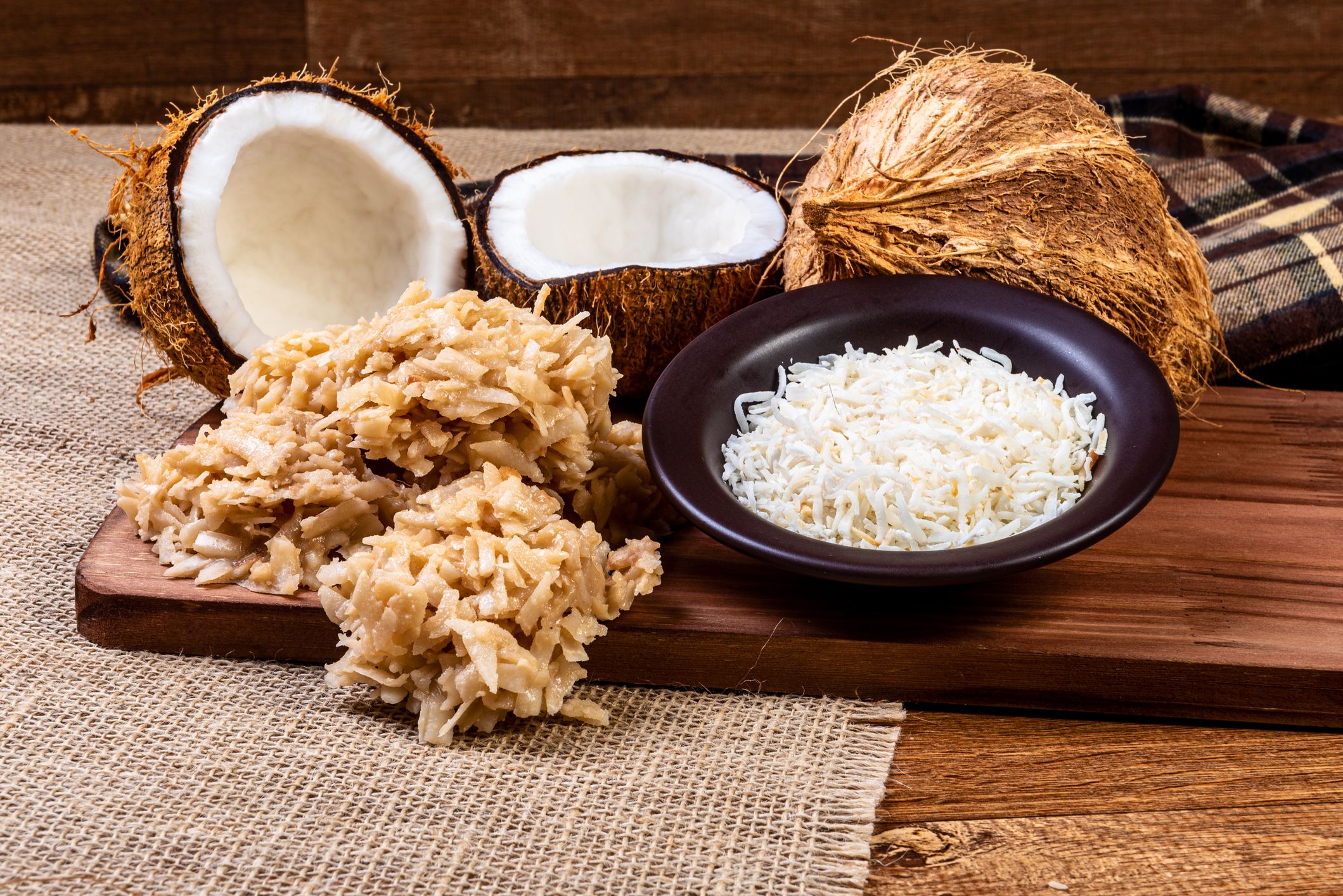 Cocada on the wooden table. Traditional coconut sweet from Brazil.